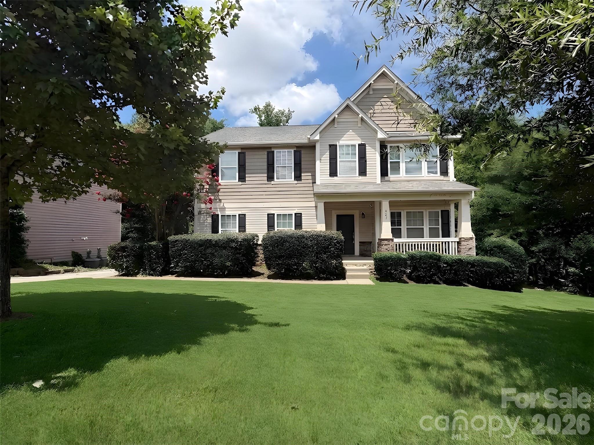 Exceptional 7BD/5BA Fort Mill home in an award-winning school district—now featuring a complete in-law suite with independent entrance! This sophisticated floor plan offers flexibility for multi-generational living, guest quarters, or rental income potential.
Main Level: Welcoming entry opens to formal dining that flows seamlessly into the kitchen via butler's pantry. The generously-sized living room connects to a spacious kitchen showcasing a huge center island with bar seating, stainless steel appliances, gas range, and abundant storage—perfect for entertaining and everyday living. 
Upper Level: Owner's suite featuring a luxurious 138 sq ft walk-in closet—an exceptionally generous retreat with room for extensive wardrobes and organization. Four additional generously-sized bedrooms, two more full bathrooms and convenient laundry room complete this level.
Lower Level—Secondary Living Quarters (NEW!): Finished walkout basement now features a fully equipped kitchen, spacious living area, and full bathroom with washer/dryer hookup. Independent exterior entrance for privacy and autonomy, with seamless interior stairs connecting to the main home. Recently upgraded with fresh paint throughout, quality LVP flooring in the living and kitchen areas, and new light fixtures. The theater room with in-ceiling surround sound speakers and projector (conveys) adds another layer of entertainment flexibility. Patio access from the walkout level.
Outdoor Entertaining: Newly installed pavers and fire pit create an inviting backyard oasis for gatherings and relaxation.
Location & Lifestyle: Close to premier shopping, dining, and entertainment; quick highway access and near the SC/NC border. Award-winning Fort Mill schools + modern comfort + investment flexibility = rare opportunity!