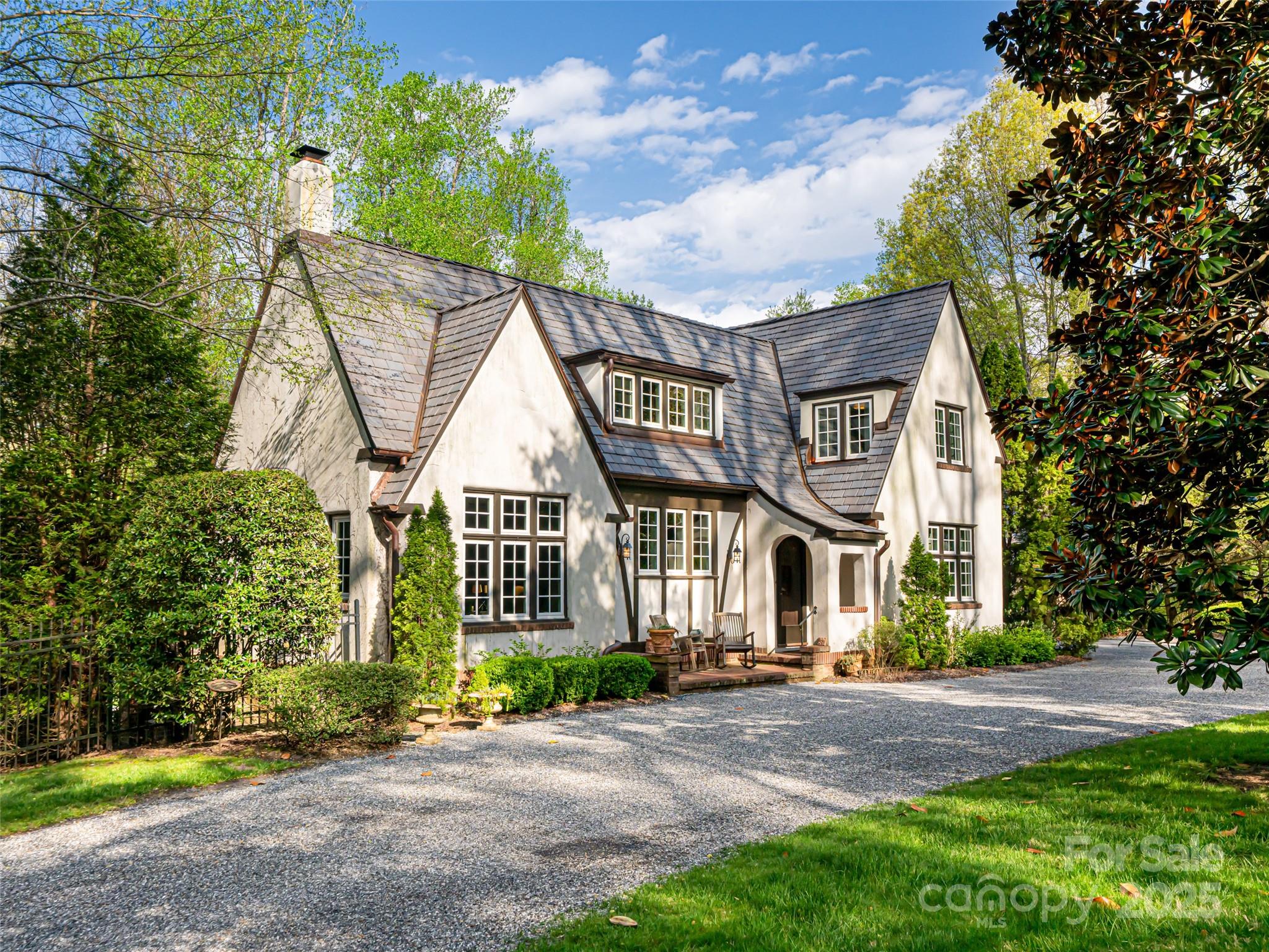 Capture this rare opportunity to own a stunning french design historic home in the town of Biltmore Forest. The home was constructed in 1929 and is perfectly placed on a 1.25 acre lot. Kitchen updated in 2018 , featuring high end Thermador appliances that make cooking a delight. The interior shines with modern upgrades including updated bathrooms with luxurious heated floors ensuring comfort year-round. The home is equipped with high- performance, WeatherShield windows, New DaVinci roof with lifetime warranty and new Train furnace installed in 2020. Step outside to enjoy the fully fenced backyard on a level lot, ideal for entertaining and outdoor activities. The serene pool, designed and constructed by Signature Pools, offers a perfect retreat for relaxation and diversion. This remarkable property harmoniously blends timeless elegance with modern conveniences making it an exceptional place to call home.