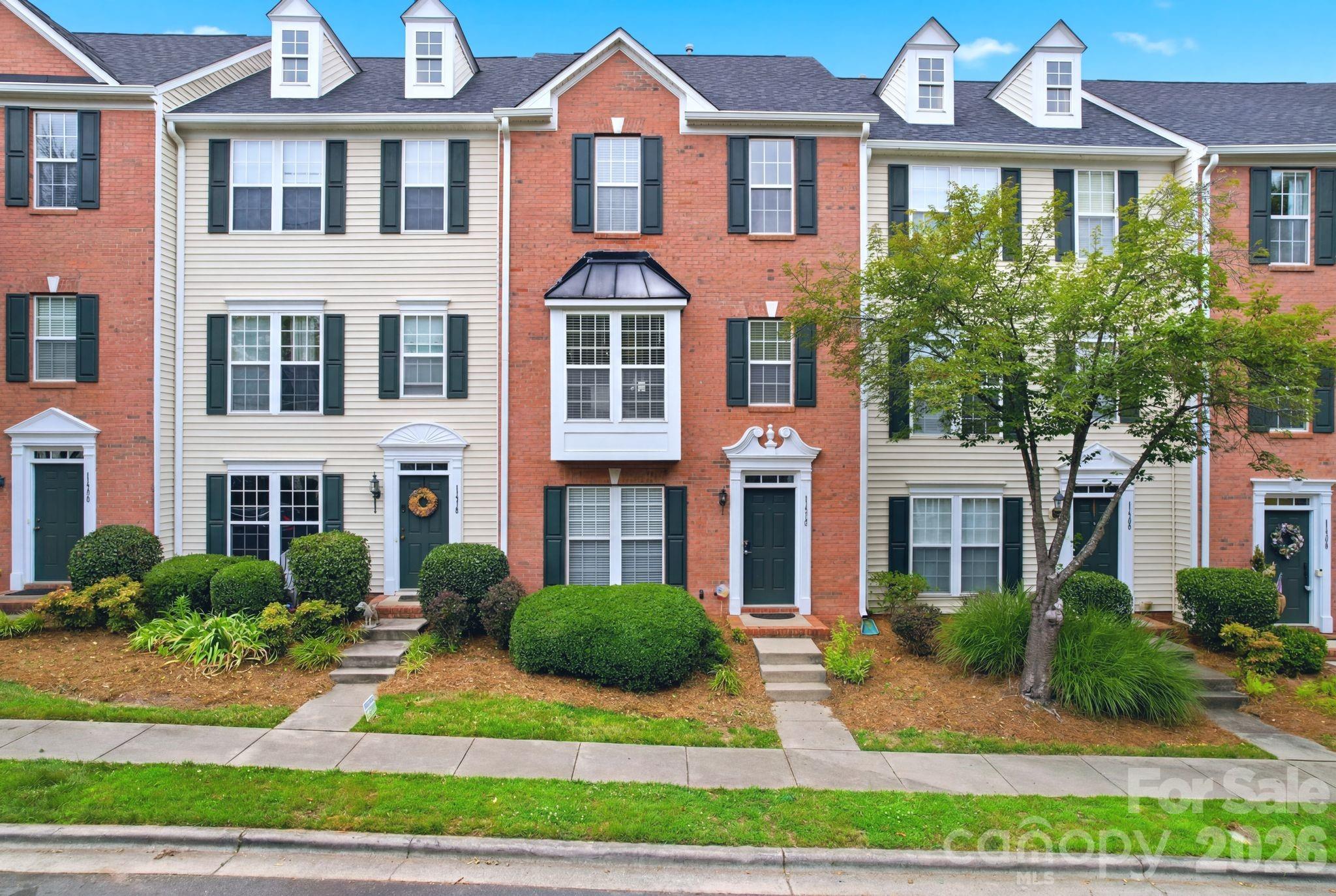 Welcome to this beautifully updated 3-story brick-front townhome offering flexibility, style, and an unbeatable location. The entry level features a spacious flex room with a closet, ideal for a home office, guest room, workout space, or potential third bedroom.

The main living area is filled with natural light and features an open-concept layout designed for comfortable everyday living. The family room includes a gas fireplace and flows seamlessly into the dining area and kitchen. The kitchen offers cherry cabinetry, a center island, and a spacious breakfast area. French doors open to a balcony, providing a great spot to enjoy your morning coffee or unwind at the end of the day.

Upstairs, the primary suite features a tray ceiling, a large walk-in closet, and a beautifully updated en-suite bath with custom tile and a glass shower door. A generously sized secondary bedroom, full hall bath, and conveniently located laundry area complete the upper level.

Move-in ready and extensively updated, this home features new laminate flooring throughout, fresh interior paint, and modern finishes. The oversized garage provides additional storage space and includes a utility sink.

With no rental restrictions, this property presents an excellent opportunity for both homeowners and investors. Community amenities include a swimming pool, and the location is hard to beat—within walking distance to shopping, dining, and entertainment at Stonecrest and just minutes from I-485, making commuting throughout Charlotte simple and convenient.
