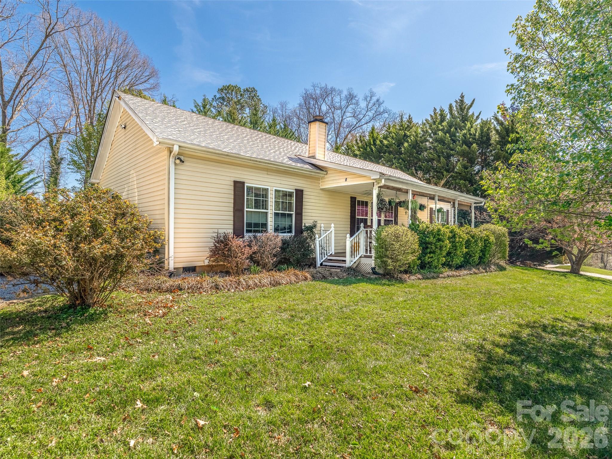 Charming and well-maintained home tucked away on a quiet road just 15 minutes from Asheville. Thoughtfully designed with a split bedroom floor plan, this home offers both comfort and privacy, complemented by 9’ ceilings, a cozy wood-burning fireplace, and an easy, functional layout. Enjoy mountain views from the covered front porch, or unwind and entertain on the back deck overlooking a private yard. Ample parking and a spacious setting add to the overall usability of the property. Conveniently located near Asheville’s amenities yet outside city limits with no HOA and no city taxes. A well-rounded property with a setting that’s easy to appreciate.