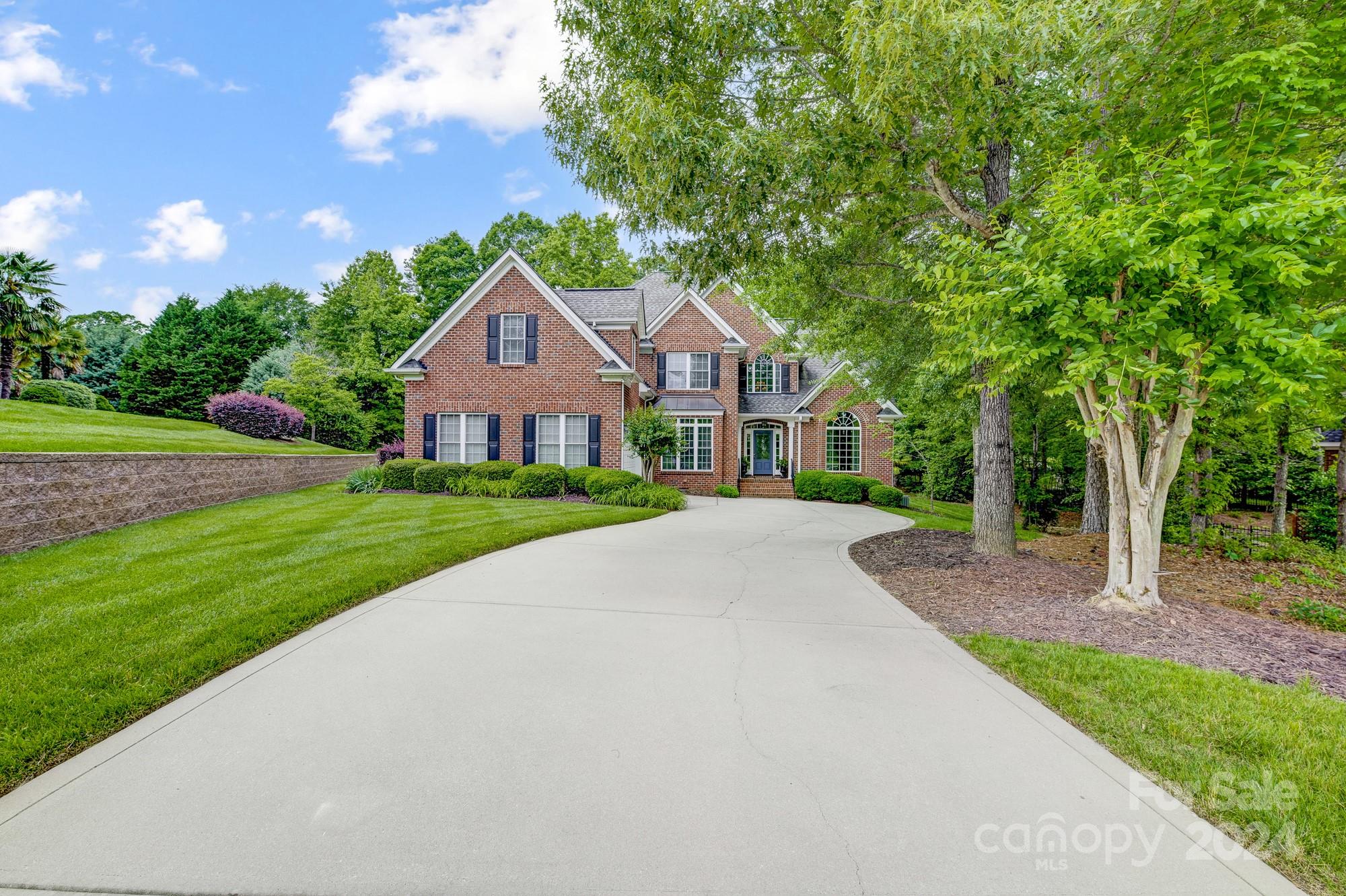 Look no further. This gorgeous custom home sits in a cul de sac in one of Rock Hill's favorite premier communities, Laurel Creek. Home features the primary bedroom on the main level with tray ceiling & jetted tub. Spacious kitchen with granite, pantry, dbl wall oven & gas cooktop. Windows in living room, dining room, kitchen and entry have solar tinted film. Family room has a gas fireplace and vaulted ceiling. Foyer and living room also have vaulted ceilings. Hardwood floors throughout main living areas, tile in bathrooms and laundry. 3 additional bedrooms and large bonus room upstairs. Huge 345 sq ft screen porch/sunroom with E-Z breeze windows, tile floor and wood burning fireplace (with gas starter) is the perfect place to entertain or relax after a hard days work. This home has excessive attic storage and closet space! Laurel Creek is only a few miles off I-77 and has miles of shaded walking trails, a pool and tennis courts.