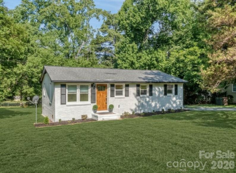 Beautifully updated full brick ranch style home in historic Waxhaw - Two blocks from the Waxhaw community center and park with fields, playground and walking trails - Four blocks to downtown Waxhaw for shopping, dining and entertainment - All the amenities of Charlotte with the charming feel of a smaller town - You won't see the finishes this home has in anything else in this price point - Amazing kitchen with new everything from the cabinets to the appliances - High end quartz countertops and backsplash - Gold finishes and hardware - All new appliances including refrigerator, washer and dryer - Wood flooring throughout home - Primary suite with private bath and walk in tiled shower - Two generous secondary bedrooms share another full bathroom - Window treatments - New HVAC - New hot water heater - Literally every detail in the home has been carefully sourced and thoughtfully curated for the home - There is nothing left to worry about except moving right in - Large, level lot - Large community area with so much right at your fingertips - Imagine coming home for the weekend and not having to hop back in the car to do anything .. just pop around the corner and enjoy the weekend - Photos do not do the finishes in the home justice and you won't regret your decision to come for a visit - Call anytime for more details or your price showing!