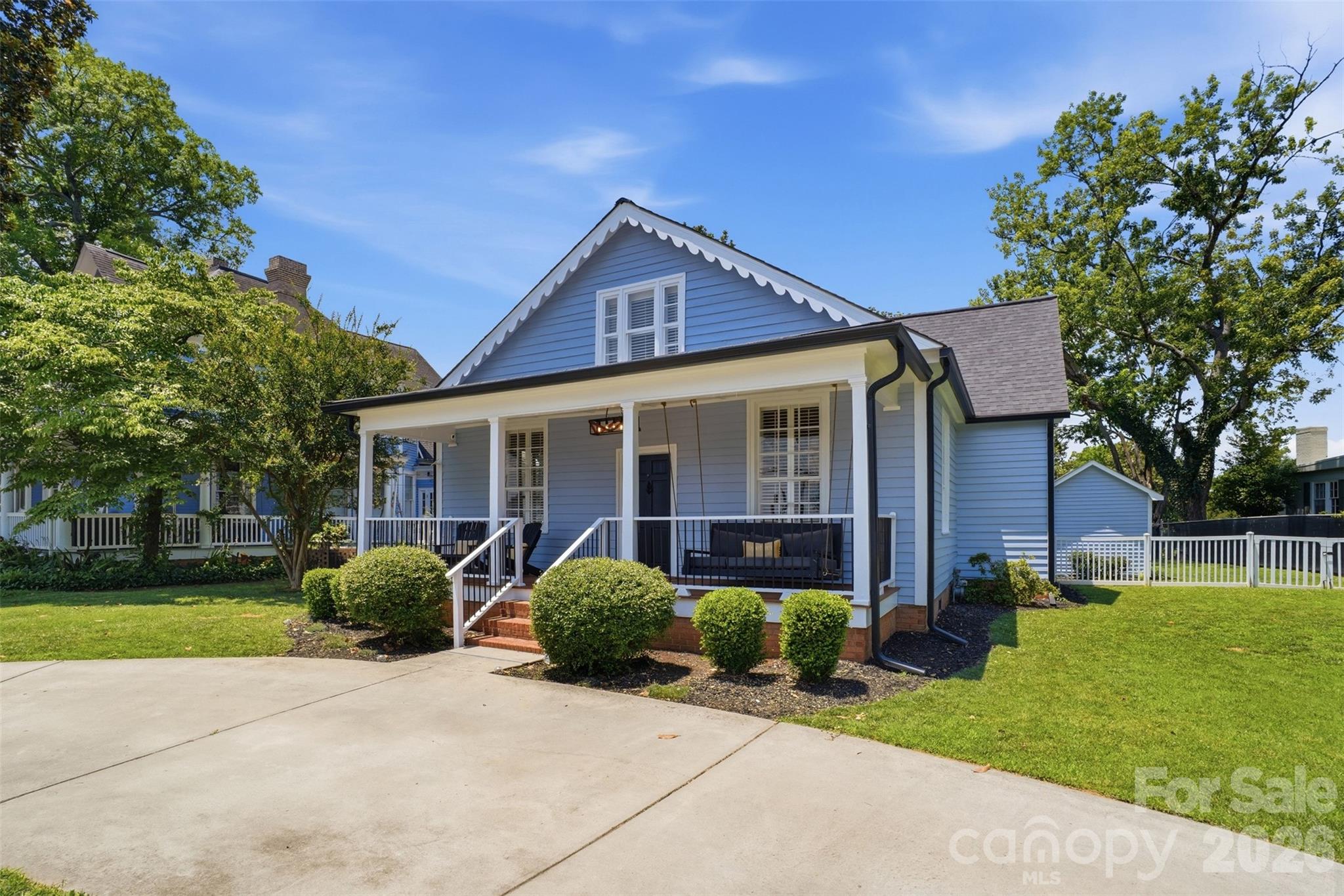 Step into a rare piece of Newton history with this beautifully restored and updated Main Street residence, originally built in 1848. Perfectly blending timeless character with modern luxury, this one-of-a-kind home offers an exceptional opportunity for homeowners, investors, or those seeking a potential short-term rental or Airbnb property in the heart of downtown Newton.

Renovated in 2017, the home showcases original architectural charm, rich hardwood floors, abundant natural light, and thoughtfully updated living spaces. The spacious chef's kitchen features a large granite island, gas cooktop, and inviting breakfast area, creating the perfect setting for everyday living and entertaining.

The primary suite offers a peaceful retreat with a luxurious tile shower and spa-like atmosphere. Upstairs, you'll find flexible living space ideal for additional bedrooms, a home office, studio, media room, or private guest quarters. An additional 308 square feet of heated and cooled space is not included in the total square footage, providing even more versatility.

The home's historic exterior has recently undergone extensive restoration and professional painting, preserving its timeless character while enhancing curb appeal, structural integrity, and long-term value.

Outside, escape to your private backyard oasis featuring mature landscaping, a fully fenced backyard, and a charming covered pergola designed for year-round outdoor living. Whether enjoying your morning coffee, hosting gatherings, gardening, or providing a secure space for pets and play, this outdoor retreat offers the perfect blend of privacy, functionality, and relaxation.

Located just steps from vibrant downtown Newton, you'll enjoy a walkable lifestyle with easy access to local restaurants, coffee shops, breweries, wine bars, boutiques, art galleries, community events, and the popular Newton Farmers Market. Spend weekends exploring local shops, enjoying live music, meeting friends for dinner, or visiting nearby tasting rooms—all just moments from your front door.

Whether you're looking for a historic residence, investment property, Airbnb opportunity, or simply a distinctive home with modern updates and small-town charm, this exceptional property delivers it all.