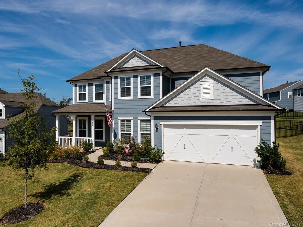 Wow what a house! Like new 5 BR, 3.5 BA home on a great cul-de-sac. Open floor plan w/ rocking chair front porch, custom enclosed patio, spacious gourmet kitchen, stainless appliances, center island breakfast bar, butler's pantry & great room w/ gas log fireplace. Large 1st floor master w/ tray ceiling, bath w/ garden tub, separate shower & dual sinks. Backyard screened Porch has beautiful stone fireplace & overlooks wide open space behind the house. Hard to duplicate property.