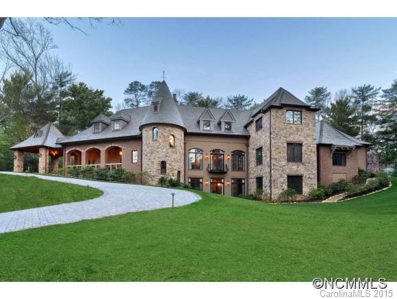 Magnificent 3-story Old World Normandy-style home designed by Griffin Architects on secluded knoll near Biltmore Estate. Built in 2010 to highest standards in architecture, technology & comfort w/ space & intelligence that cater to 21st C. needs. Generous main floor w/terrace lives & entertains w/ ease; expand to lower & upper floors for recreation & guests. Close to membership Country Club. In-town convenience! MUST SEE LIST OF DETAILS/FEATURES