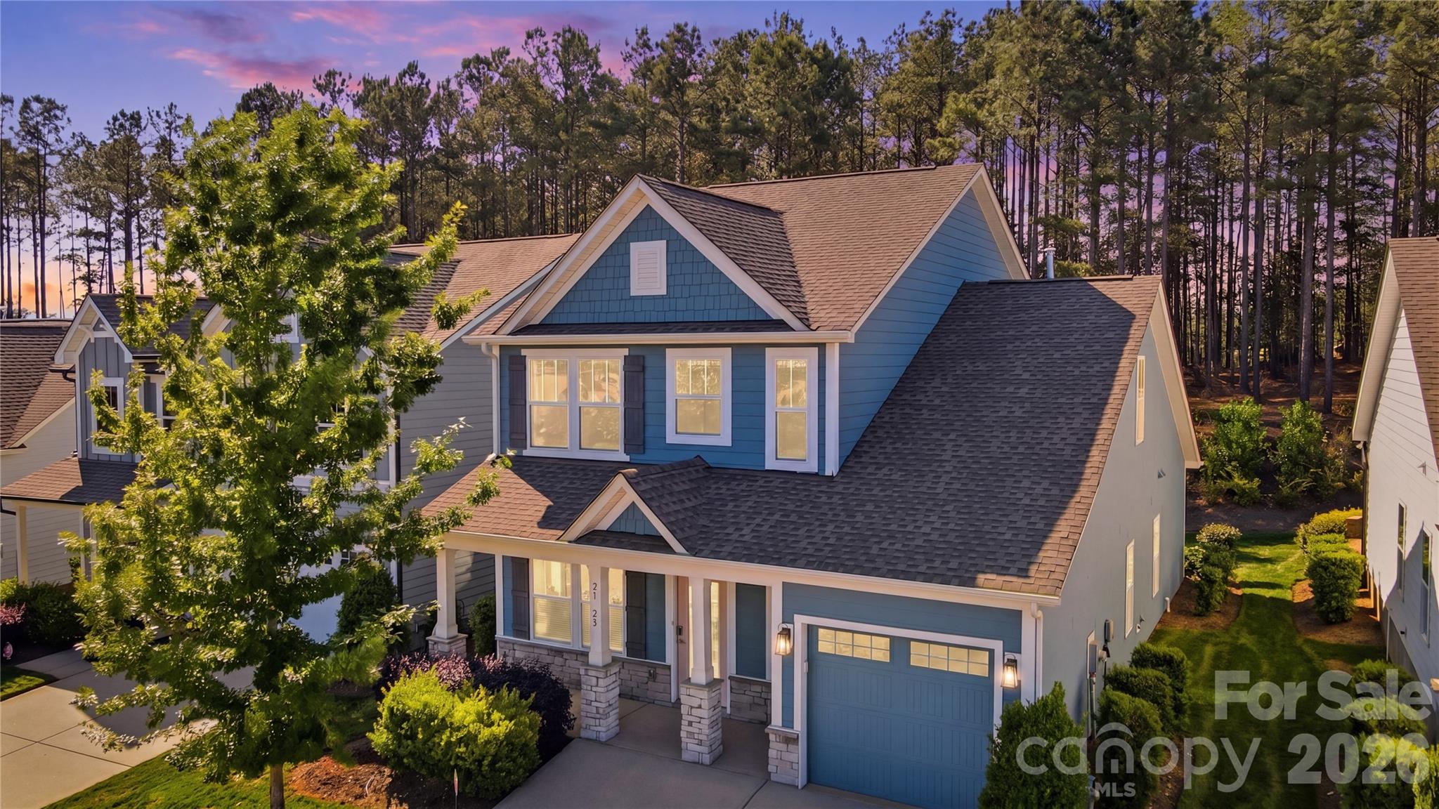 Absolutely stunning Builder MODEL HOME in the highly sought-after lakeside community of Edgewater, NEVER lived in and loaded with upgrades throughout. This light, bright, and open floor plan offers 3 bedrooms and 2.5 baths, with a luxurious primary suite conveniently located on the main level. Situated on a premium homesite, the home faces a spacious pocket park and backs to serene woods, creating a rare sense of openness and privacy.  The chef’s kitchen is beautifully appointed with upgraded quartz countertops, a gas range, 36” staggered cabinetry, a large farmhouse island, and a porcelain farmhouse sink—perfect for both everyday living and entertaining. The main-level primary suite features a tranquil wooded view, elegant tray ceiling, spacious walk-in closet, and an upgraded semi-frameless shower.  Additional highlights include a dining room with shiplap accent wall, hardwood stairs, and an expansive second-floor loft ideal for entertaining or relaxing. Two generously sized guest bedrooms, a full bath, and unfinished storage space complete the upper level. Laundry is conveniently located on the main floor.  Designer touches abound with colonial cased openings, crown molding, and a full irrigation system. Lawn maintenance is included, allowing for truly low-maintenance living.   Popular amenities include a golf club, marina, lake activities, pickle ball, tennis, swimming pool, and more....  This is a rare opportunity to own a never-lived-in model home on one of the best lots in Edgewater! * See Virtual Tour for video walk-thru*             ........................ ** This home can be sold FULLY FURNISHED!