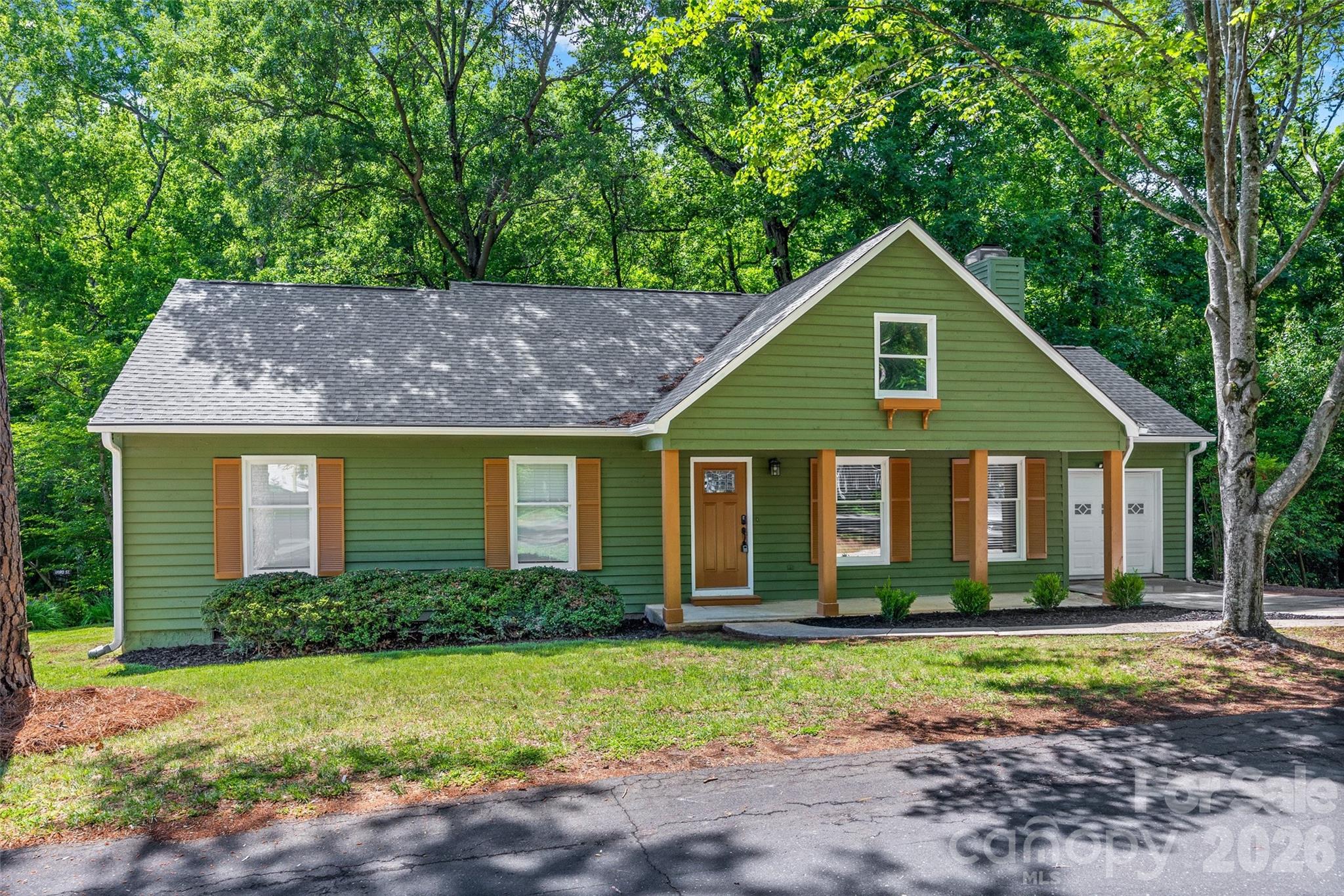 Welcome home to this beautifully refreshed ranch in the highly sought-after community of Tega Cay! Thoughtfully updated and move-in ready, this charming home offers comfortable one-level living surrounded by nature and incredible community amenities.

Inside, you’ll love the abundance of windows that fill the home with natural light from every angle, creating a bright and inviting atmosphere. Cozy up by the fireplace or step outside to the brand-new deck, where you’ll feel tucked away in your own private treehouse retreat overlooking the natural surroundings. A garage adds convenience or additional storage.

Living in Tega Cay means enjoying an active, amenity-rich lifestyle with scenic walking trails, lake access, pickleball and tennis courts, and 27 holes of golf(additional fee). Residents also have access to a community pool available for an additional fee. This is the perfect opportunity to enjoy peaceful living with resort-style amenities just outside your door!