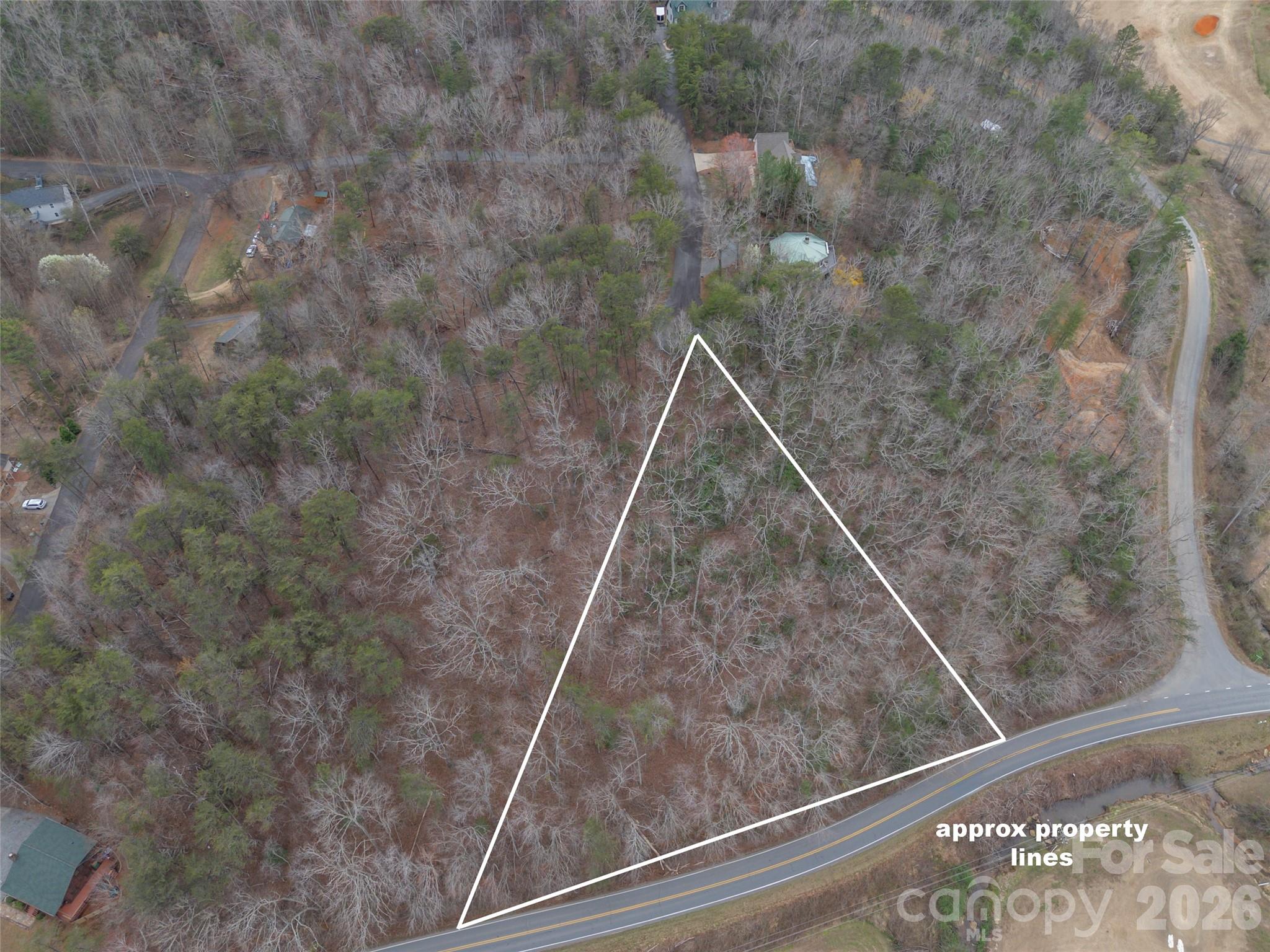 Come experience the beauty of Lake Lure and build your dream mountain getaway! This scenic lot offers the potential for stunning mountain views along with possible views of the Apple Valley Golf Course. Located in the established Carolina Mountains community, the property features a low annual HOA fee and convenient access to nearby Rumbling Bald Resort amenities. Residents enjoy a shared common area featuring a private pond and covered gazebo, perfect for relaxing and taking in the peaceful surroundings. Restrictive covenants apply. Property can be accessed from both Buffalo Creek Road and Highpoint Drive.