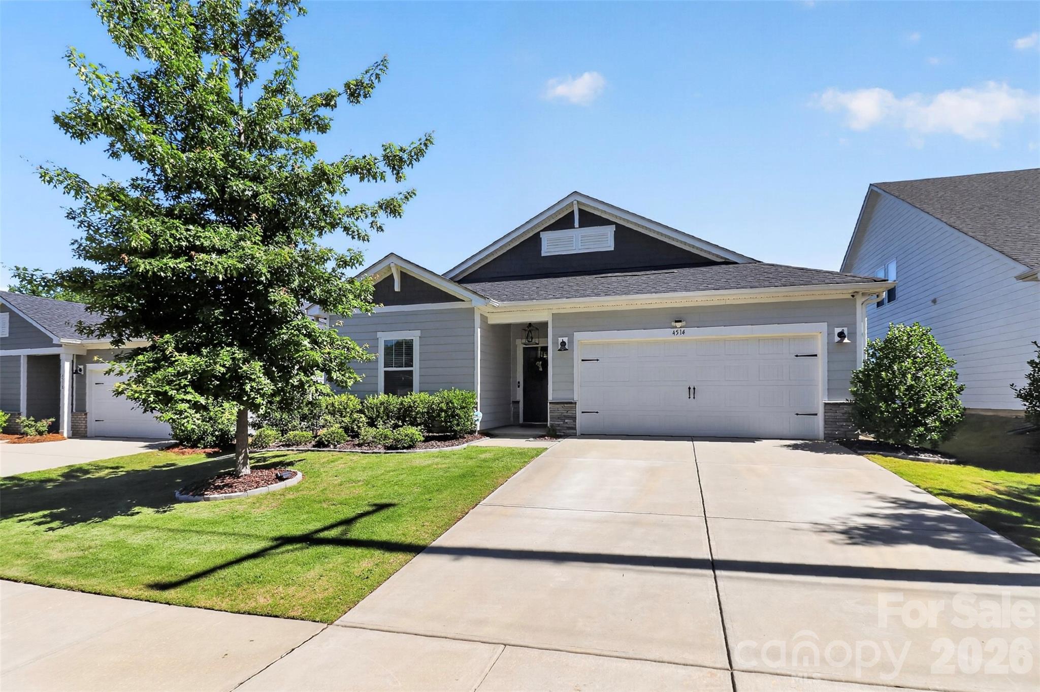 Welcome to 4514 Bright Road, a beautifully maintained 3-bedroom, 2-bath home with a flex room and covered outdoor living space in the highly sought-after Vineyards on Lake Wylie. This move-in ready home stands out with thoughtful custom improvements, smart-home features, and exceptional attention to detail throughout.

The open floor plan offers flexible living with a dedicated office/flex room featuring custom built-ins, a stylish kitchen with ceiling-height cabinetry, designer lighting, updated fixtures, and convenient storage solutions, plus a spacious primary suite designed for comfort. Professionally painted throughout, the home also features smart lighting and switches, Cat5e wiring, integrated security, custom closet systems, and built-in organization that make everyday living easier.

Step outside to your private backyard retreat complete with a fully fenced yard, expanded stamped concrete patio, roll-down shade, privacy wall, irrigation system, mature landscaping, and outdoor lighting—creating the perfect space for relaxing or entertaining year-round.

Beyond the home, enjoy a lifestyle that feels like a private resort. The Vineyards on Lake Wylie offers two pools, a clubhouse, fitness center, walking trails, playground, dog park, pickleball and bocce courts, a sports complex, and Lake Wylie access with a boat ramp, dock, and storage for kayaks and paddleboards.

Conveniently located just minutes from the River District, historic downtown Belmont, Charlotte Douglas International Airport, and Uptown Charlotte, this home offers the perfect blend of modern convenience, outdoor recreation, and community living.