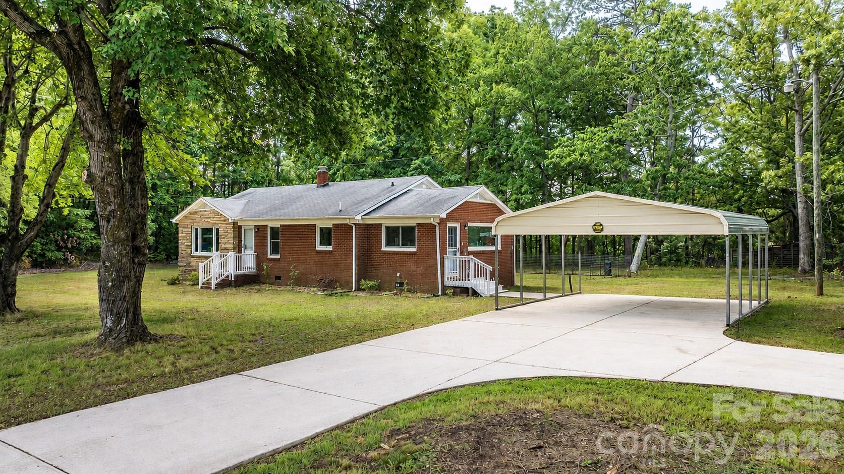 Welcome to this well-maintained 3-bedroom, 2-bath brick home situated on 1.54 acres in Maiden. This property offers a peaceful setting with beautiful mature trees and plenty of outdoor space to enjoy. Recent updates include new windows, new exterior front door, and a carport added by the current owners. An electric vehicle charging station is already in place for added convenience. There is a list of updates available in the attachments.  Whether you're looking for room to spread out or simply enjoy a quiet country setting, this home is ready for its next owner.