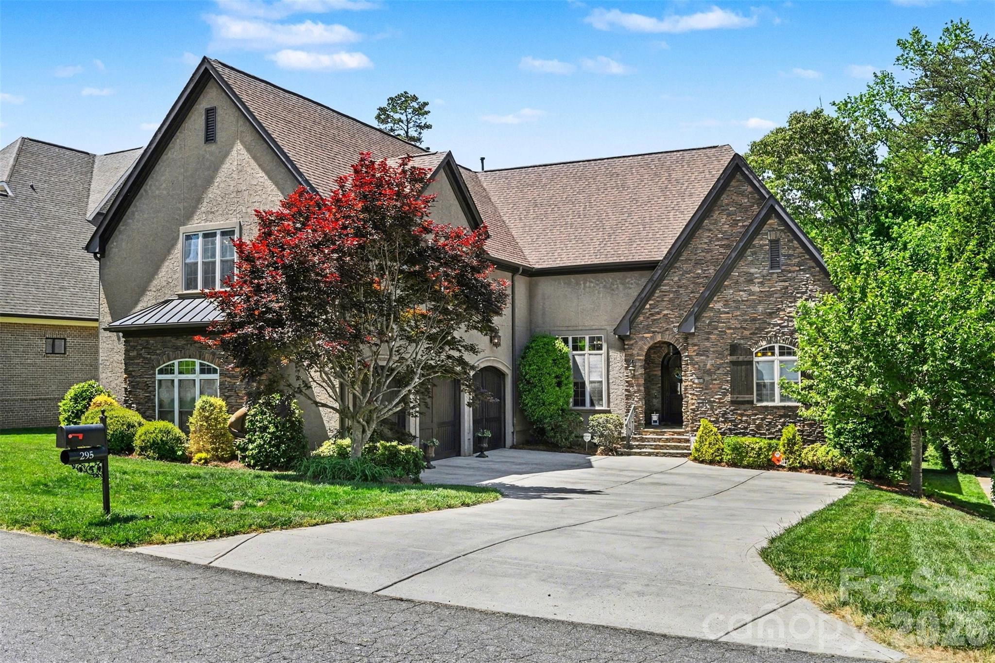 Nestled in the highly sought-after TreeTops at Cowans Ford, just off Hwy 73 in Lincoln County, this beautifully maintained and move-in-ready custom 2 story home offers a perfect blend of comfort, flexibility, and ample space for entertaining. The community boasts exceptional amenities anchored by Cowans Ford Golf Club offering various membership tiers, social offerings, a community pool, pickleball & tennis courts, dining, and access to Lake Norman (www.cowansford.com). This neighborhood is beautifully maintained with surroundings that provide privacy, charm, and southern elegance. 

Spanning just over 5,000 square feet, this home offers a harmonious blend of comfort and functionality. With five bedrooms, four full baths, a custom office, and a generous amount storage, it caters to various lifestyles and entertaining needs inside and out. The upper level features a spacious bonus or recreational area with its own custom bar, providing a unique touch to the home’s design.

The main level welcomes you into an expansive living area that seamlessly flows into the great room, dining area, custom office space, and chef’s kitchen. This spacious floor plan includes a cozy sitting area with a gas fireplace and French doors leading to an elevated deck overlooking the backyard, perfect for enjoying indoor-outdoor living. The chef’s kitchen stands as a true centerpiece, equipped with a large granite island, premium appliances, a gas range, pull out shelving, and ample storage. Adjacent to the kitchen is a private guest bedroom and full bath, ideal for accommodating guests for any occasion. The primary bedroom offers a large privately positioned retreat from the day, seamlessly transitioning into an elegant ensuite. This ensuite features a double vanity, soaking tub, walk-in shower, and dual walk-in closets, providing a luxurious experience.

Additional main-level highlights also include a mudroom, laundry area, convenient hidden staircase access to the upper floor, and a spacious three-car garage with EV charging station, built-in storage units, and extended height garage doors for additional clearance.

The upper level boasts three additional bedrooms, two full baths, and an expansive bonus room. This versatile space can be transformed into a media room, playroom, or home gym, catering to diverse interests and needs. The bonus room also includes a large walk-in closet and a custom wet bar with ample counter space, perfect for entertaining guests during game day, private workout retreat, or hosting a family movie night.

The property is conveniently located in the Lake Norman area just minutes away from Denver, Huntersville, Cornelius, Birkdale, I-77 or NC-16 for access to Charlotte. 

Sellers have completed a home inspection. Available upon request.

**Offering a complimentary one year Home Warranty through Americas Preferred Home Warranty**
