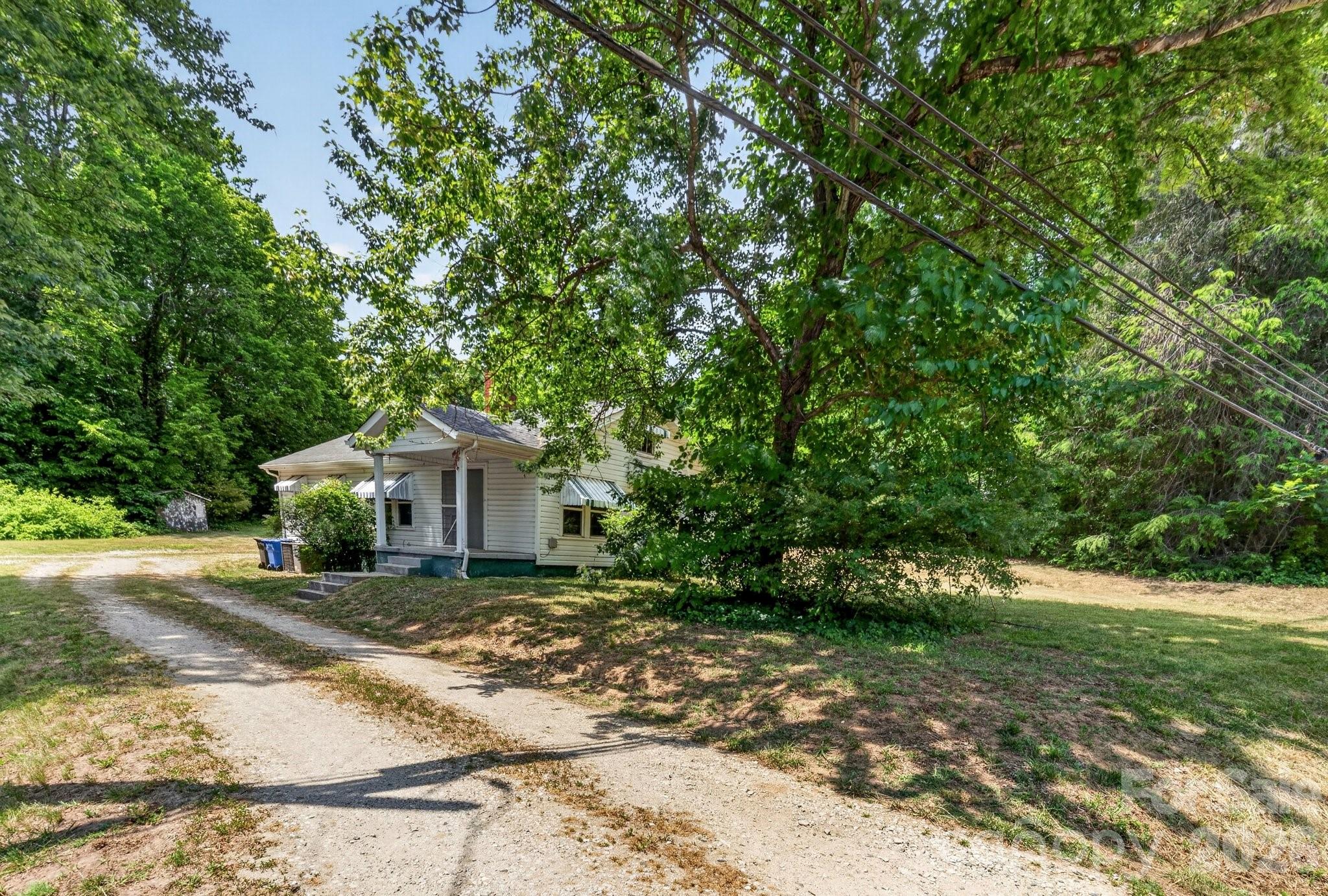 Unlock a rare opportunity in one of Mooresville’s most desirable areas. This property sits in a top-rated school district and offers quick access to downtown Mooresville, local events, dining, and shopping.

The .92-acre lot is a true standout — unusually large for the area — and includes a charming home with original features such as vintage door hardware, solid interior doors, and classic trim. Renovate it to your vision or remove it and build the custom home you’ve always wanted.

Water and sewer are already on the property, adding tremendous value and flexibility.
Being sold as-is.

This location is in high demand, and opportunities like this don’t come often.
Property line photos are estimates; buyer to verify.