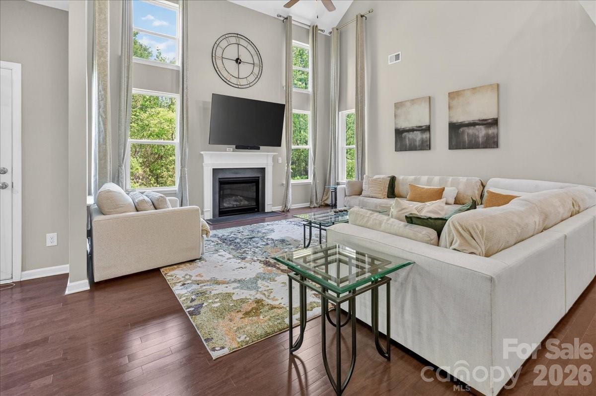 Compare this home to anything else in Concord under $1M and the value jumps off the page. Three finished with levels with double staircases on the main along with in-law suite plus an office. Five bedrooms. A 3-car garage with epoxy floors. A daylight walk-out basement already built out for a media room, gym, or in-law setup. All of it at the end of a cul-de-sac in Hearthwood, backed by an acre of wooded privacy.

The kitchen is the real deal: gas cooktop, double wall ovens, oversized island. Cathedral ceilings run the foyer and two-story great room, anchored by a gas fireplace. Upstairs and down, the layout flexes — home office, guest suite, game room, whatever the next chapter needs.

The big-ticket items are already handled. Rear deck structurally reinforced, refinished, and weather-sealed in 2025. Well pump replaced in 2024. All three HVAC systems serviced annually. Full-yard irrigation on a dedicated well — no water bill for that acre.

Rocky River Elementary is a half mile away. Concord Mills and I-485 access in minutes. Move in, unpack, done.

Schedule your showing before someone else does the math first.