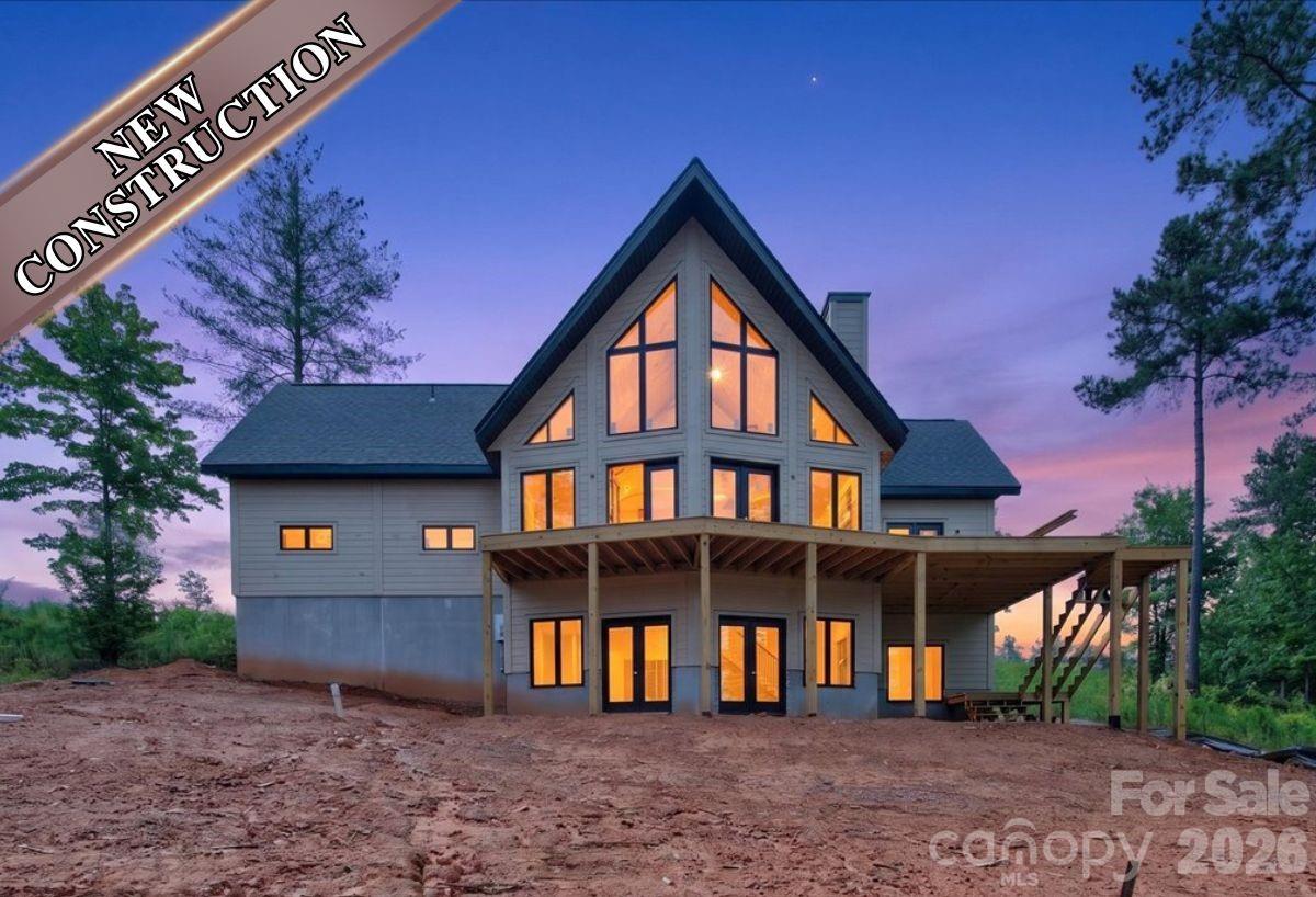 Welcome to lakefront living at its finest in the prestigious Lakeside Reserve community on beautiful Lake Rhodhiss. This stunning new construction home blends rustic charm with modern luxury, featuring award-winning insulated log technology for exceptional energy efficiency and year-round comfort. Situated on a private waterfront lot, the home offers breathtaking lake views, soaring ceilings, abundant natural light, and an open-concept design perfect for entertaining or relaxing.
With 4 bedrooms, 4.5 bathrooms, and over 2,700 square feet of thoughtfully designed living space, this custom A-frame retreat showcases a spacious great room with a fireplace, a beautifully appointed kitchen, and expansive outdoor living areas overlooking the water. This dockable lot provides direct access to Lake Rhodhiss, making it easy to enjoy boating, kayaking, fishing, or simply soaking in the peaceful surroundings.
Residents of Lakeside Reserve enjoy an unmatched lifestyle with gated security, a clubhouse, resort-style pool, pickleball courts, walking trails, lakeside parks with community kayak access. Whether you're searching for a full-time residence or waterfront investment, this remarkable property offers the perfect combination of comfort, style, and recreation in the foothills of North Carolina.