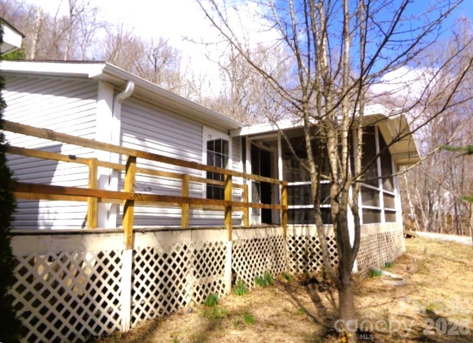 Discover peaceful country living in this inviting 3-bedroom, 2-bathroom doublewide home set on 1.4 beautifully wooded acres. Surrounded by mature trees and natural scenery, this property offers privacy, comfort, and plenty of room to enjoy the outdoors. The main home features an open floor plan with a large living area, a kitchen with ample storage, and a bright dining space perfect for gatherings. The primary suite includes a private bath and generous closet space, while two additional bedrooms provide flexibility for family, guests, or an office.
Adding even more value, the property includes guest quarters complete with a kitchen and full bathroom—ideal for extended family, visitors, or potential rental income. Enjoy the peace and quiet of rural living while being just a short drive from town amenities. With its spacious layout, extra living space, and scenic wooded surroundings, this property offers the perfect blend of comfort, versatility, and tranquility.