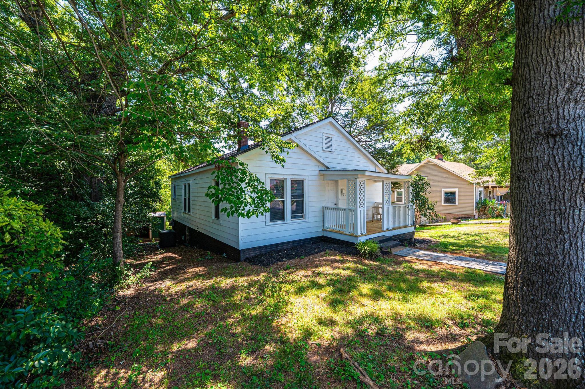 Charming updated home in Newton offering a clean, comfortable layout with fresh neutral finishes throughout. The home features updated flooring, a bright kitchen with white cabinetry and modern countertops, and a refreshed bathroom. Natural light gives the interior an inviting feel, while the covered front porch and spacious yard provide great outdoor usability. Conveniently located near downtown Newton, shopping, dining, and major roadways, this home is a great opportunity for a primary residence or investment property.