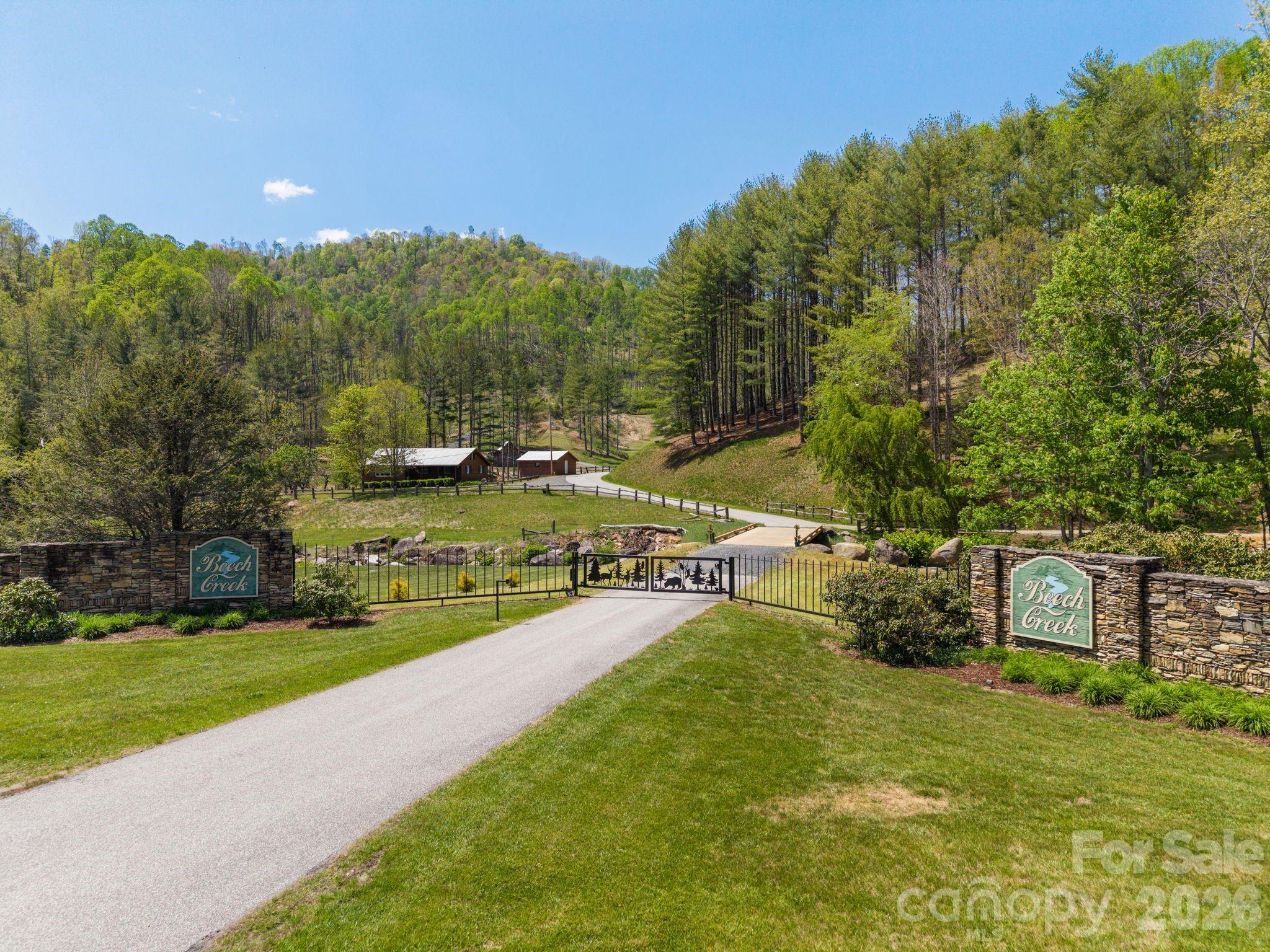 Tucked away in the peaceful gated community of Beech Creek, this private 1.43-acre parcel is the perfect place for your dream home or mountain getaway. Whether you're looking to build a peaceful full-time residence or a relaxing second home, this property offers the space and serenity to make it happen. With the rare opportunity to purchase the adjoining lot as well, you can expand your vision or enjoy even more seclusion. Across the street, protected community green space with a pond provides a scenic and tranquil backdrop with no homes to be built directly in front of you. Conveniently located approximately 1 hour from Asheville and around 35 minutes to Unicoi, Tennessee, you can enjoy mountain privacy without sacrificing access to nearby destinations.