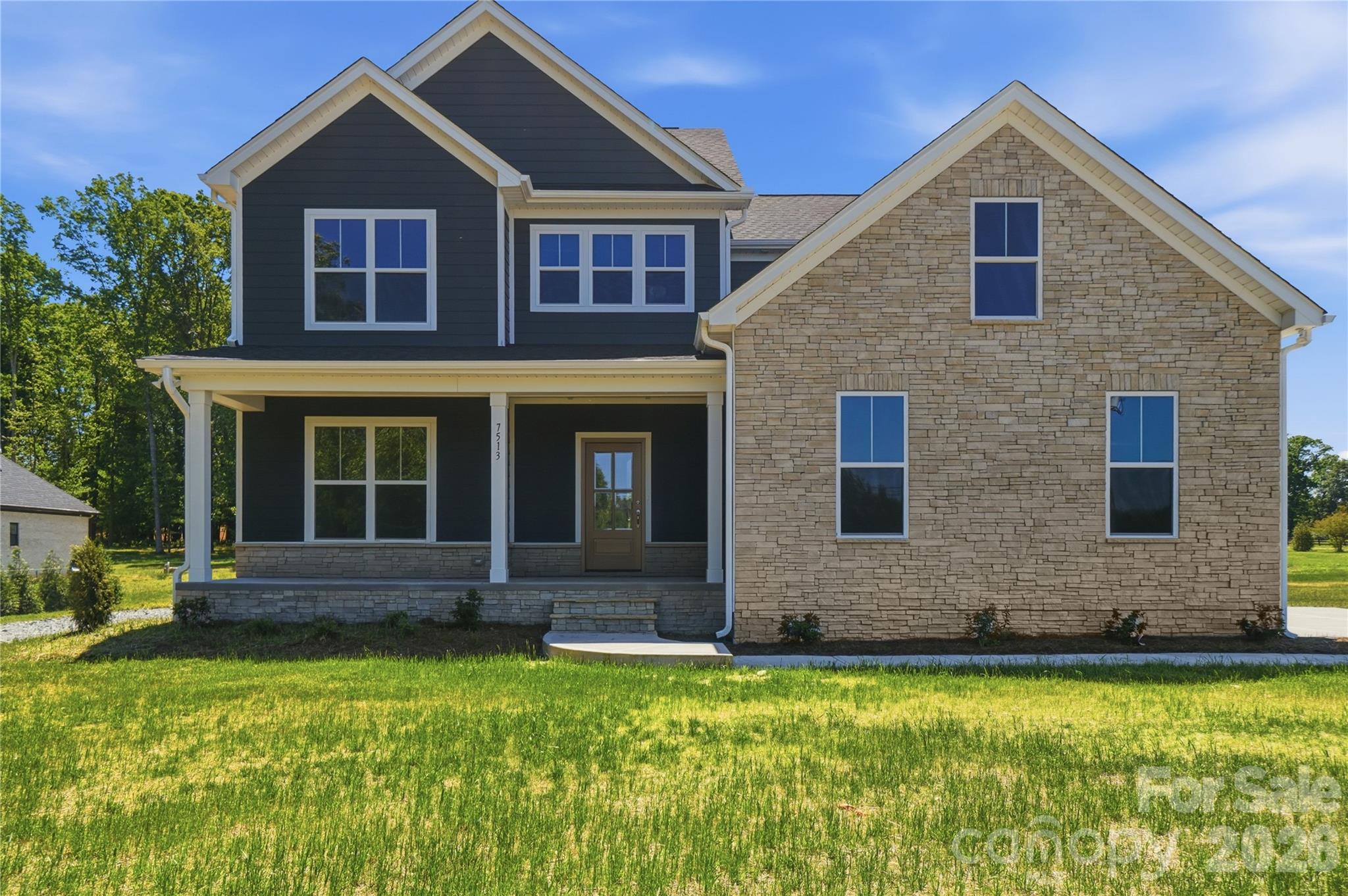 **Price Improvement** Now offered at $630,000!
Discover the Roanoke Plan, a beautifully crafted new construction home situated on 1.41 acres in Waxhaw. Offering 4 bedrooms, 3.5 bathrooms, and 2,715 square feet, this home combines thoughtful design, flexible living spaces, and modern finishes in a location that continues to attract buyers looking for room to spread out without sacrificing convenience.

A welcoming front porch leads into an inviting foyer where a private study provides the perfect space for a home office, library, or flex room. The heart of the home is the impressive vaulted family room featuring a gas fireplace and an open-concept layout that flows seamlessly into the kitchen and dining areas, creating an ideal setting for both everyday living and entertaining.

The main-level primary suite offers a private retreat with a spa-inspired bathroom, complete with a soaking tub, oversized walk-in shower, and spacious walk-in closet. Additional thoughtful features include a custom drop zone off the garage and a screened porch overlooking the backyard, providing the perfect spot to relax and enjoy the outdoors.

Upstairs, you'll find two additional bedrooms, a full bath, an open loft, and a second primary suite with its own private bath and walk-in closet, making this floor plan ideal for guests, extended family, or multi-generational living.

Located just minutes from Downtown Waxhaw, Cane Creek Park, shopping, dining, and local favorites like Maxwell's Tavern and Virtuoso Breadworks, this move-in ready home offers the rare opportunity to own new construction on over an acre with valuable builder incentives already in place.