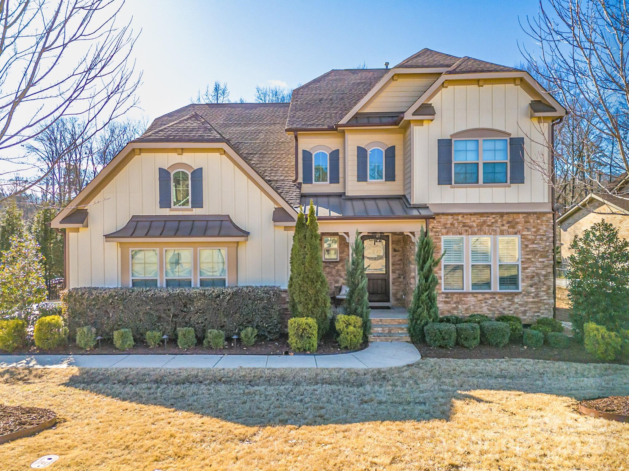 This stunning home is located in the highly desirable Eppington South neighborhood, offering a perfect blend of luxury and convenience.  With 5 spacious bedrooms and 4 full baths, including a bedroom and full bath on the main level, the home is designed for comfort and functionality. The main level features high ceilings and beautiful hardwood floors throughout, creating an inviting and elegant space. Situated on a wooded lot, the backyard is a true oasis, featuring a Travertine saltwater heated in-ground pool and a hot tub. The pool was completed in May of 2024 and is ready for its next owner. The extensive landscaping and hardscaping around the pool provide a serene, resort-like atmosphere. A screened-in-porch and deck offer ideal spaces for outdoor entertaining or relaxing. If you have been looking for a perfect home in the Fort mill area that offers Elegance, location, private backyard and an amazing pool look no further.