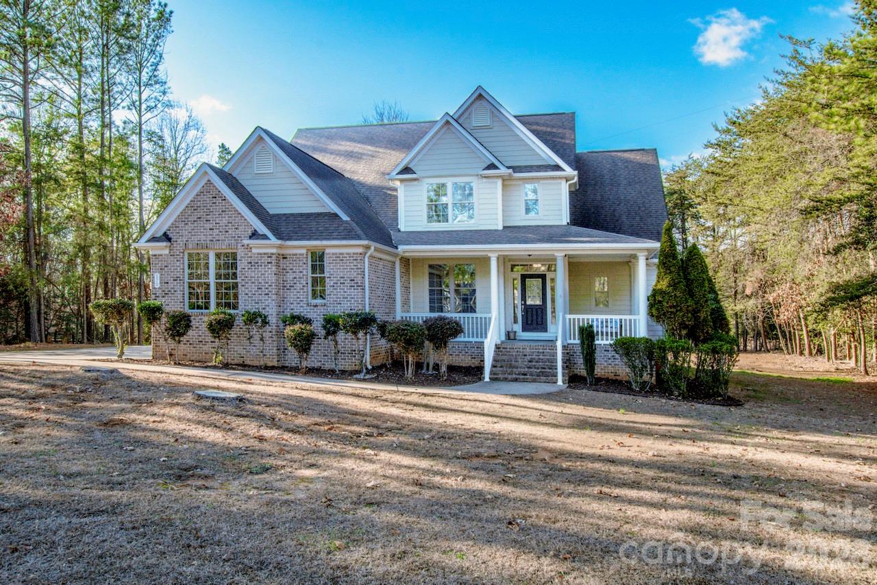 Looking for a lovely home on a flat lot on nearly one-acre?  This is it!  This beautiful home offers exceptional craftsmanship and thoughtful design throughout.  Inside, you'll find upscale and unusually gorgeous kitchen countertops with 42' cabinets, instant hot water and eat-in bar area.  Extensive crown molding and custom trim add elegance at every turn, while abundant storage keeps everything organized. Surround sound can be enjoyed in the Great Room.  The spacious primary suite on the Main level, features a stunning trey ceiling, bath with a garden tub with tiled wall, comfort height dual sinks and a private water closet. Upstairs, an enormous loft with a charming dormer and addl surround sound creates a flexible living space, along with three generously sized bedrooms, one ideal for a home office and two beautifully up-fit Baths. A well-designed laundry room includes it's own sink and exterior access.  Outdoor living is just as impressive with a charming front porch, an expansive composite back deck, that steps down into the large backyard, perfect for relaxing or play.  You will enjoy country feel, not-too-far from town.  Enjoy lake access and hiking trails within 2 miles at the gorgeous Lake Norman State Park.
