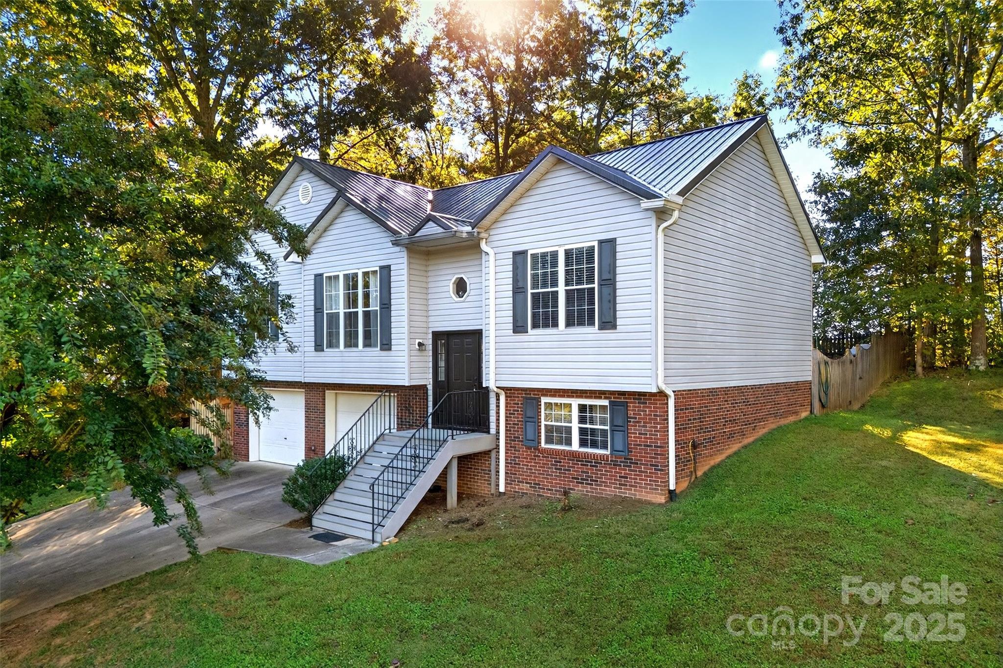 Brand NEW Kitchen with granite countertops! Here is an amazing, beautiful home located at Lake James! Includes Deeded Boat Slip! This home features a 2 car attached garage, screened in back porch, and a fenced in backyard with one section just for pets! The inside features three bedrooms on the main level and 2 full baths, the primary bedroom is a generous size, a spacious kitchen with an island, a beautiful fireplace in the living room and so much more. The lower level features an additional bonus room with a built-in murphy bed and a full bathroom. The bonus room is perfect for a gym or office space. The home has a deeded boat slip and is the last one on the left, even if you don't own a boat it's the perfect place to launch kayaks or paddle boards! The community boat slip is a short walk from the house and located in a tucked away cove. The community of Laurel Pointe is quiet and a wonderful place to enjoy living near the lake! Furniture can be bought separately. Schedule a showing today!