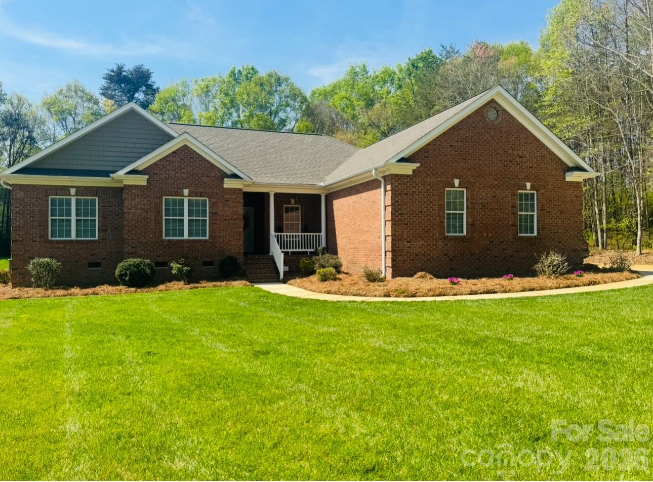 BACK ON THE MARKET AT NO FAULT OF THE SELLERS....Welcome to this BEAUTIFUL, WELL MAINTAINED ALL BRICK home, perfectly located in the Grand Oaks community in Eastern Rowan County featuring an INGROUND POOL READY FOR SUMMER!!  Designed for both comfort and entertaining with 2,277 heated square feet, this 3-bedroom, 2 1/2-bath home offers elegant details and generous living spaces throughout. Step into the spacious living room featuring cathedral ceilings and a cozy fireplace with gas logs, ideal for relaxing evenings. The formal dining room features gorgeous wainscoting and tray ceilings, while a dedicated office or flex space provides versatility for work or hobbies. The primary ensuite is a true retreat, showcasing a tray ceiling and space for a reading nook. The bathroom includes a luxurious garden tub with custom built-in shelving, stand-alone shower, separate toilet room, beautiful marble flooring, custom cabinetry and the space connects to a walk in closet for convenience. The heart of the home is the chef-inspired kitchen, complete with custom cabinets, granite countertops, and stainless steel LG appliances including refrigerator, electric range, dishwasher, and microwave. Enjoy ample cabinet space, a walk-in pantry, breakfast/dining area, and a spacious laundry room for everyday convenience. Step outside to your private oasis — an all-brick covered spacious patio with beautiful details in the brick, overlooking a private in-ground pool equipped with a diving board, perfect for summer fun, family gatherings, or peaceful relaxation. An added feature of this home is a built-in irrigation system in the front lawn, helping maintain a beautiful, lush yard year-round. This home offers the perfect blend of elegance, functionality, and lifestyle. (Roof-Replaced 2025)