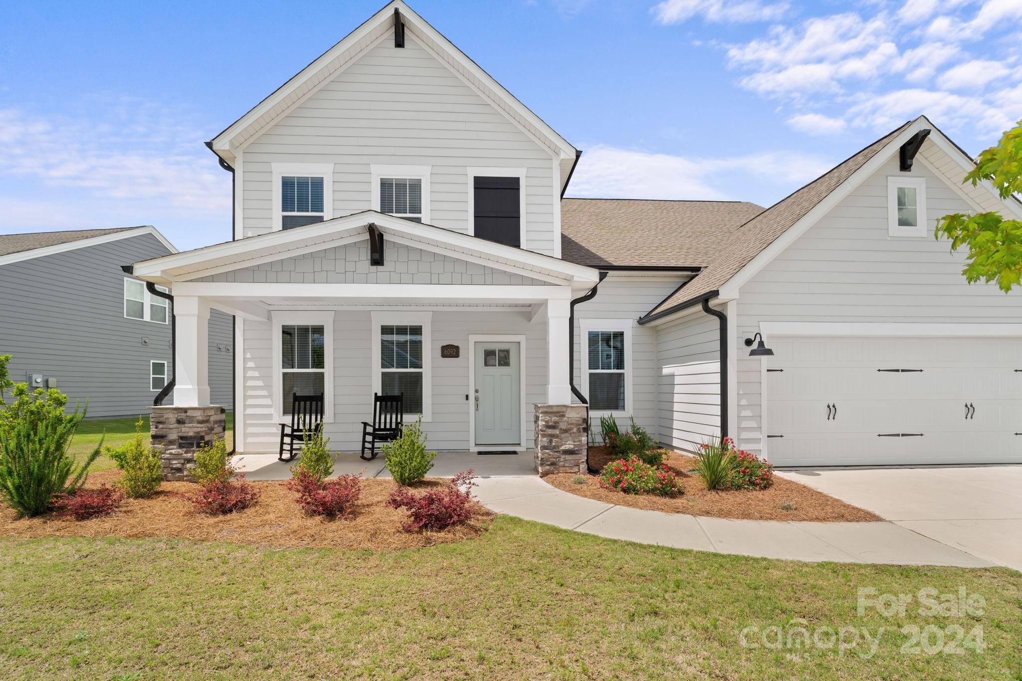 Immaculate home with beautiful upgrades! This home was designed to enjoy life with the ones you love! It has an open floor plan for entertaining, a large island to gather around, a guest suite on main, a flat backyard and patio, and a beautiful community pool to enjoy throughout the summer. The kitchen is upgraded with white quartz, a beautiful grey tiled backsplash, soft-close cabinets, and 42" upper kitchen cabinets. Luxury mohawk vinyl floors downstairs, and barefoot blinds throughout with a lime-time warranty. Remote garage opener and smart door camera operable on your phone!