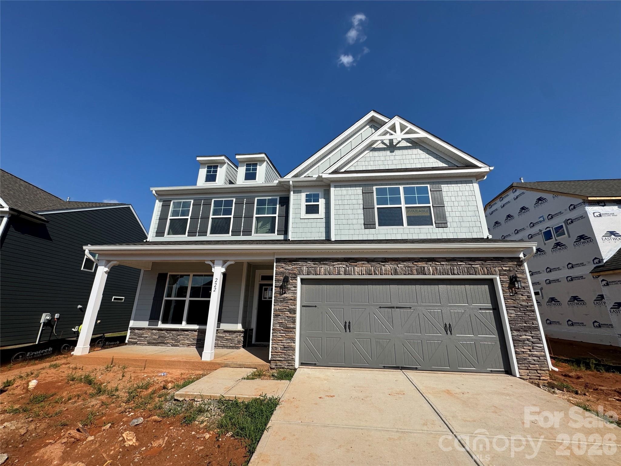 Brand new construction in an amenity-rich community less than two miles from Lake Norman! This 2-story Davidson plan has 5 bedrooms, 3 full baths, and more than 3,000 square feet of living space. The kitchen features grey cabinets, quartz counters, tile backsplash, a stainless range hood, and stainless appliances, including a gas cooktop. The same design carries through to the butler pantry, which also has a built-in wine refrigerator. The main floor also includes a guest bedroom, a full bathroom with a 4-ft shower with bench seat, dining room with tray ceiling, mud room with drop zone, and family room with gas fireplace. The upper floor has the primary suite with a luxury shower, three secondary bedrooms, a full bath, loft, and laundry room. Other extras include foyer with tray ceiling, soft-close cabinets, and stairs with composite treads & metal balusters. Community amenities include a pool, cabana, pickleball courts, and pocket parks. Find out more today!