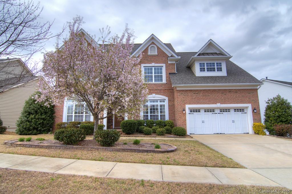 Spacious, elegant, loaded with beautiful features and upgrades.  Backing to woods this home offers a nicely landscaped play yard with a patio and fire pit, delightful chef's kitchen, pretty cherry hardwood flooring, accented by a stone fireplace, guest suite & full bath on main.  Gorgeous Master Suite on second level, along w three bedrooms and huge bonus room.  Basement offers a large recreation room, media room, exercise & an additional bedroom/full bath with tons of storage. Fort Mill Schools