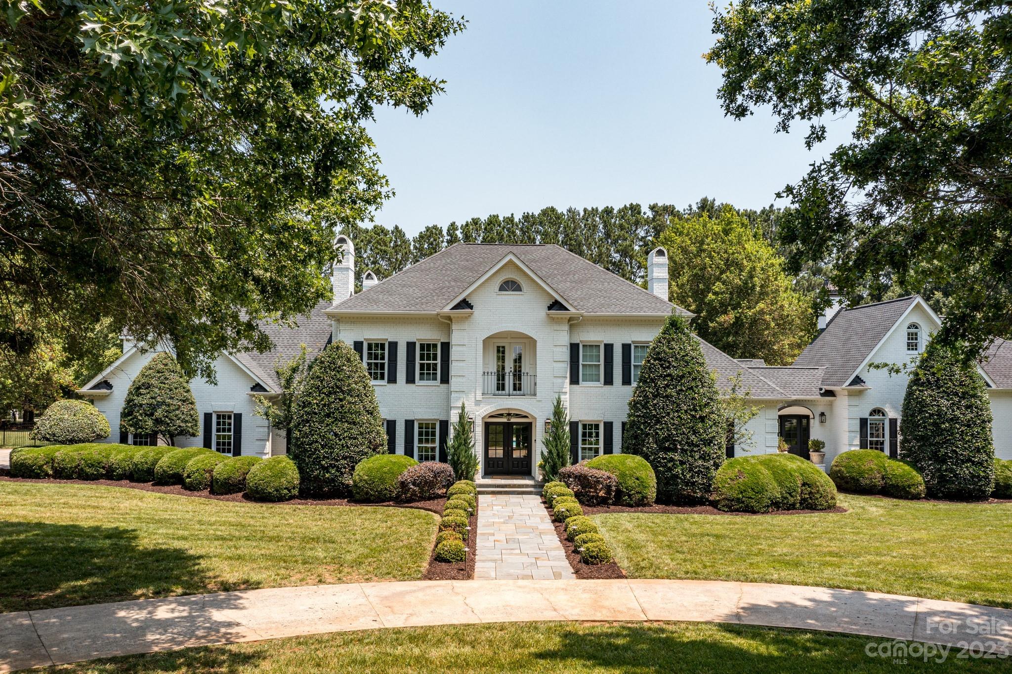 A true Southern Estate like no other, privately situated on 2.24 acres in the prestigious gated community of Walden At Providence. Enjoy entertaining inside and out. As you enter the home you will be greeted by an open foyer and grand staircase. The perfectly planned layout of this home displays the beautiful view of the private grounds that include a saltwater pool, hot tub, two fireplaces and oversized porch that are on display through all the windows and french doors that line the back of the house. Kitchen has Thermador and Sub-Zero appliances.