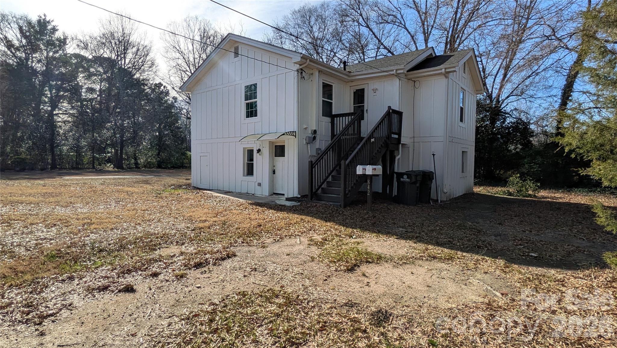 Come make this Duplex your next great investment! Upstairs/Downstairs units, each two bedroom, one bath. New in the last 5 years are windows, exterior staircase, board and batten siding, main sewer line from the home to the street, PEX supply lines. Unit A (downstairs) features updated electrical, updated cabinets. Both units are equipped with electric baseboard heat, washer, dryer, electric range, and refrigerator. Downstairs unit is currently occupied. The home shares a large concrete driveway with the house next door, with parking for both units. Set back from the street, this home is quiet and private. Listing agent has ownership interest in property.