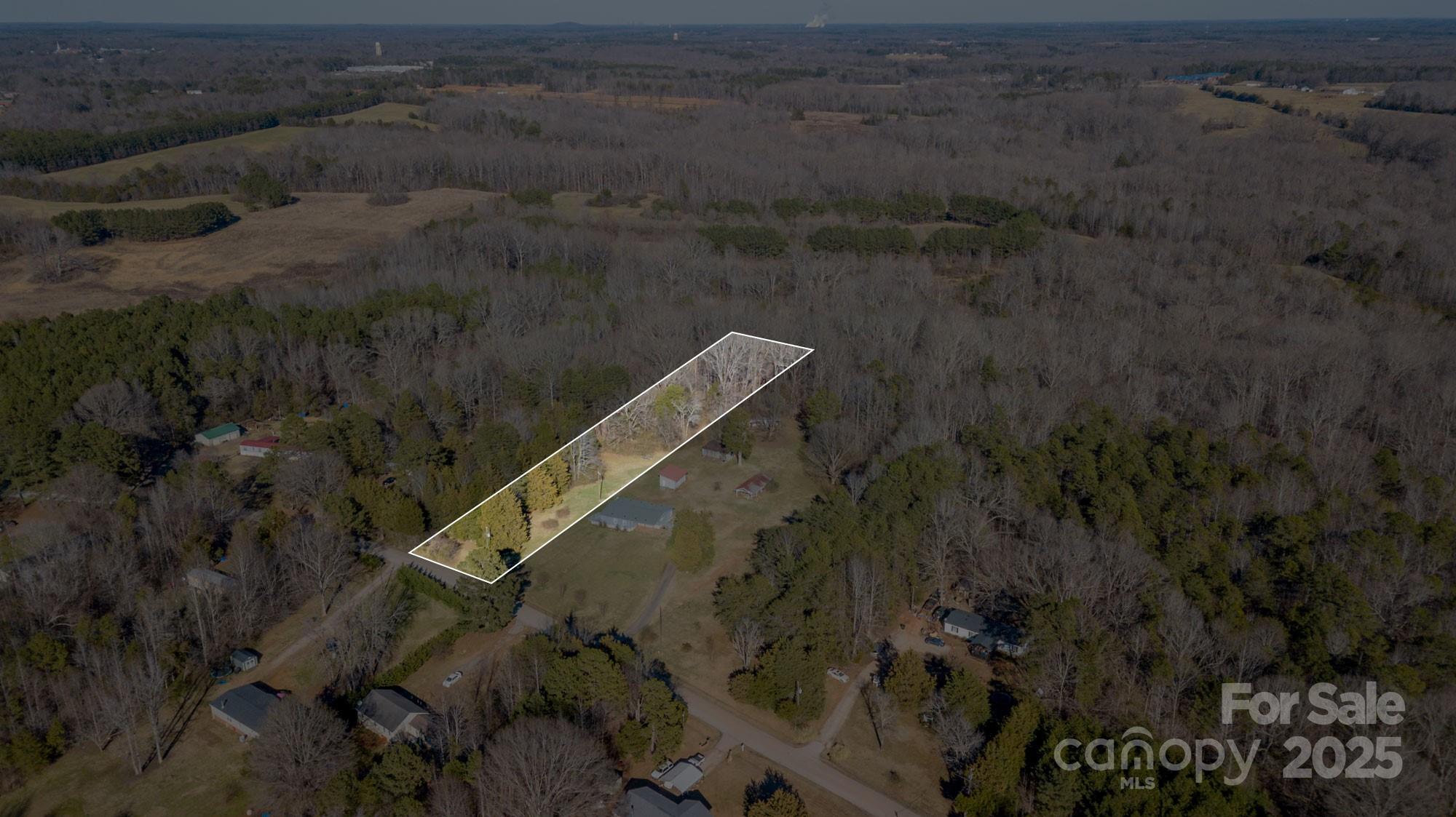 Partially wooded, 1.80 acre lot with no restrictions or HOA is ready for you and your new home!  Zoned for Manufactured Homes! Get ready to garden or raise your chickens & goats.... whatever your heart desires!  The property has not had a perc test.  Buyer will be responsible for obtaining same.