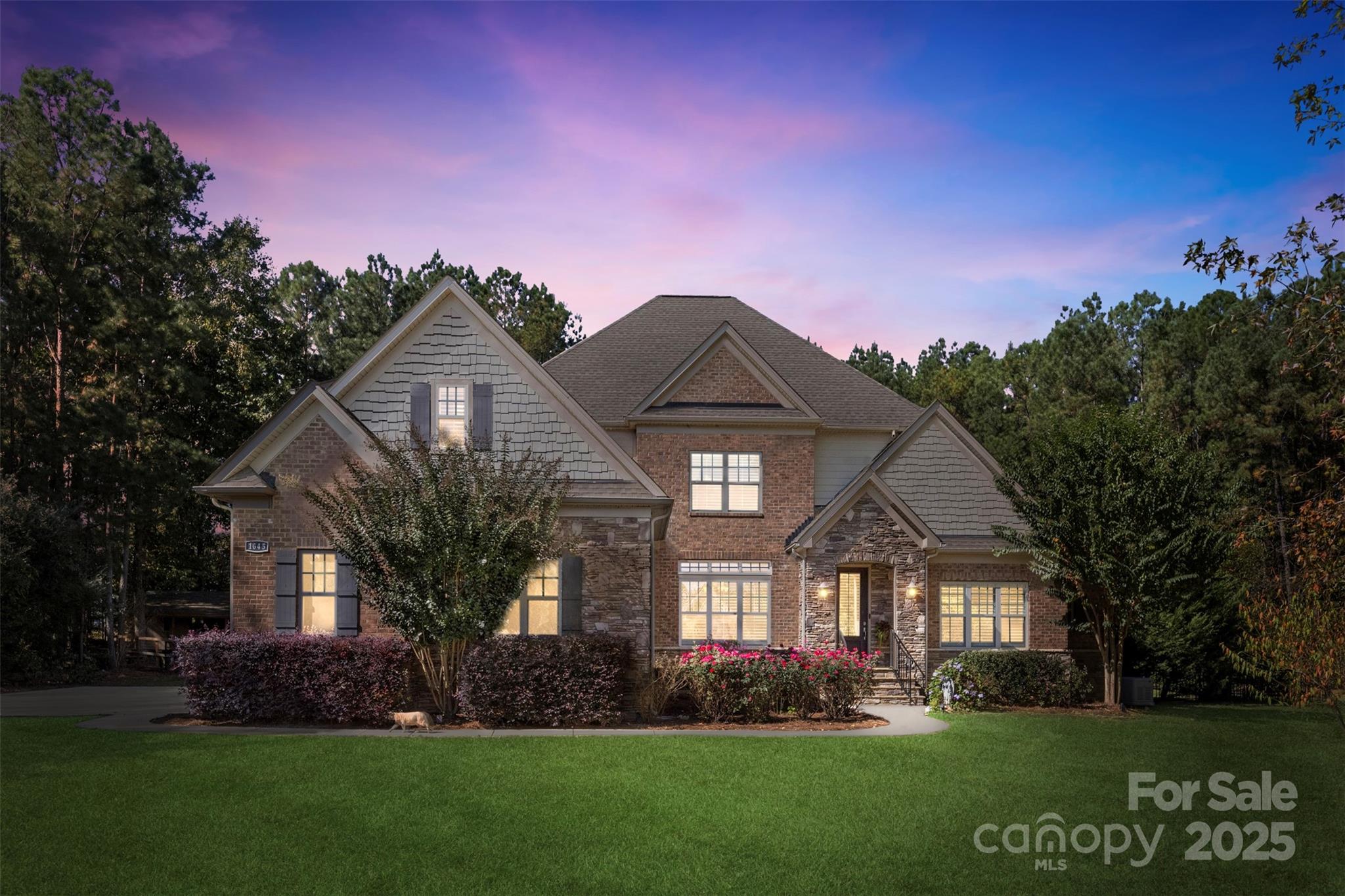 Welcome to Olde York Farms — a rare opportunity to own a true country estate in one of York’s most exclusive communities. This exceptional property showcases luxury country living at its finest on 5.66 acres of mature, wooded landscape. Fully fenced with a private gated entrance, the home offers an elegant estate presence with unmatched privacy and tranquility.

Enjoy outdoor living at its best with a custom stone fireplace and pizza oven, expansive patio, and beautiful sports pool — all surrounded by the beauty of nature. Inside, you’ll find a formal office with double glass doors, a formal dining room, and a soaring two-story great room that opens to a spacious kitchen featuring picturesque views of the property and outdoor amenities.

The primary suite on the main level boasts a luxurious spa-like bath and generous walk-in closets. An additional guest bedroom on the main level adds flexibility and convenience. Upstairs, you’ll find three more bedrooms plus a large bonus room over the garage — perfect for recreation, media, or hobbies.

With thoughtful design, abundant storage throughout, and numerous upgrades inside and out, this home offers both comfort and peace of mind. Enjoy low South Carolina taxes, award-winning York schools, and a convenient 30-minute drive to Charlotte, offering the perfect blend of country serenity and city accessibility.