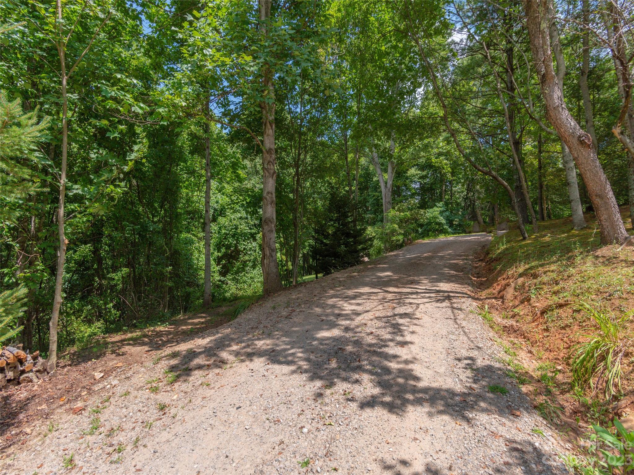 Make your dream of building in Western North Carolina a reality with this beautiful south-west facing lot in Hunter's Ridge.  You'll have end of road privacy and gorgeous views with this over 2.5 acre lot. Relatively short driveway access and ease of grading and clearing for a fall away walkout basement make this an easier build. This lot already has 3 bedroom septic approval on file with Haywood County. Just under 3,500 feet in elevation, only 15 minutes to downtown Canton, 30 minutes to downtown Asheville and 10 minutes to I-40.
