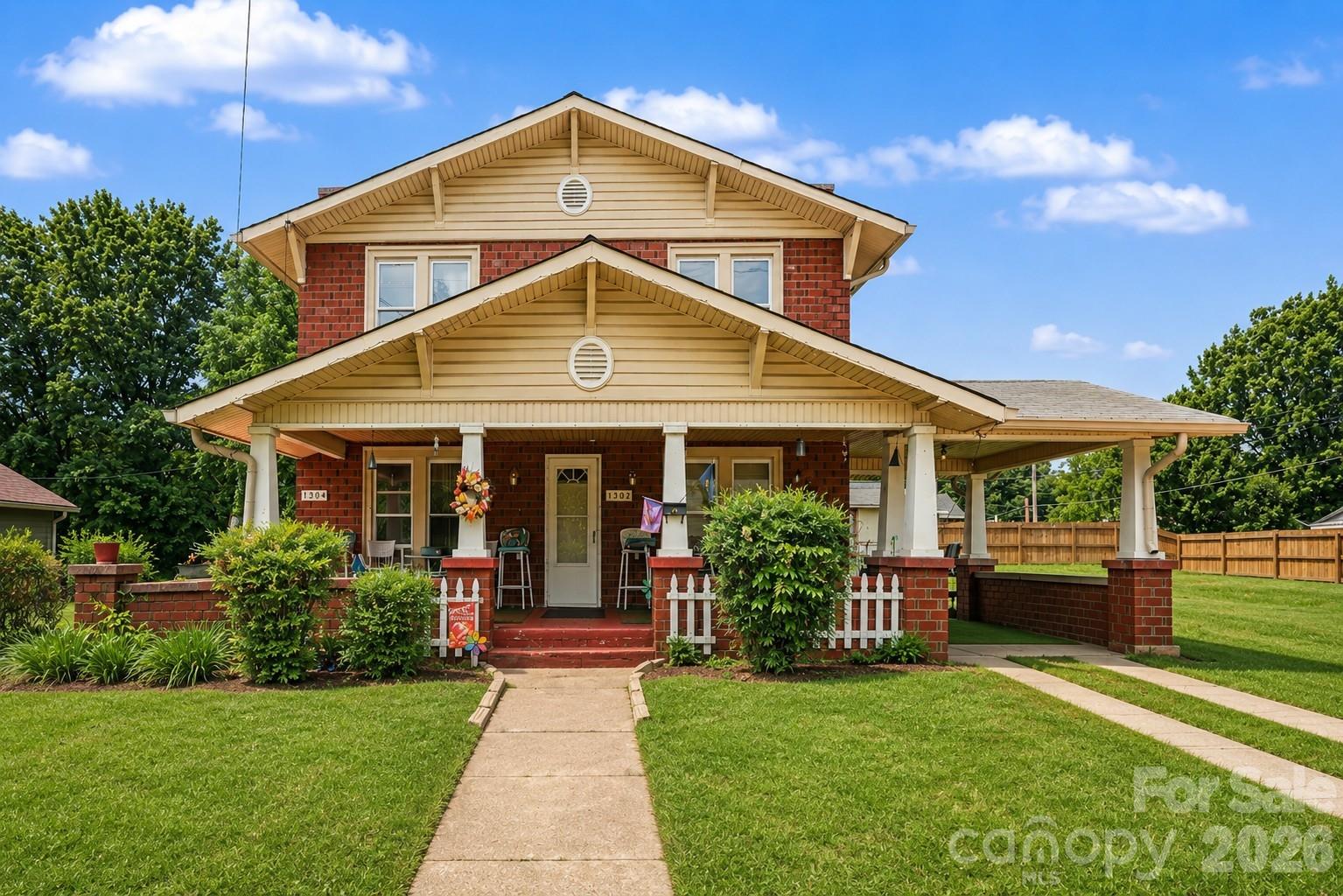 Opportunity knocks at 1302 & 1304 Wilson Lee Blvd in Statesville. This spacious property offers incredible flexibility for investors, multi-generational living, rental income, or a homeowner looking to create their ideal space. Featuring over 2,262 square feet, the home includes two kitchens, multiple living areas, dining space, sunroom, laundry area, covered carport, front porch, and rear deck. Tax records reflect a 4-bedroom home; however, the flexible layout is currently being utilized as a 5-bedroom property. Full of character and ready for your personal updates, this property offers excellent potential for added value and flexible living arrangements. An additional buildable lot adjacent to the home is included, providing an opportunity for future development or another residence. Previously utilized as commercial space but currently residential, this unique property combines space, versatility, and investment potential all in one. Home is currently owner occupied, and showings are available by appointment on Fridays only during the month of June. Photos may include virtual staging for illustrative purposes to showcase the property’s potential.