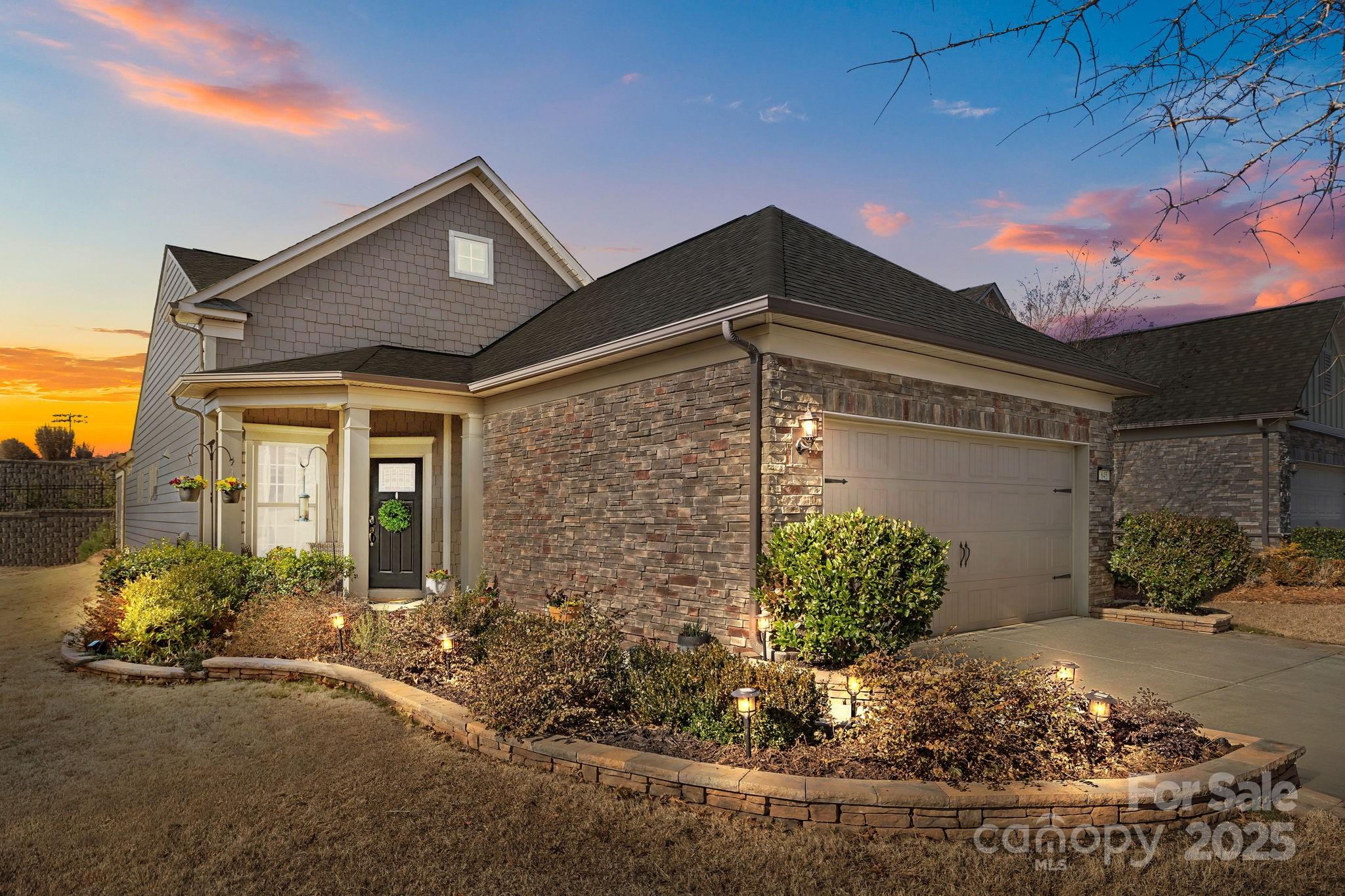 ONE OF A KIND!! Beautifully upgraded home designed for comfort and style. The home features a private guest suite with a pocket door and transom, a relocated laundry room in the entryway, and a custom office with built-in cabinetry, shelving, and desk. The kitchen includes extra cabinets, an under-counter microwave, a pantry, and a beverage fridge.The dining room is brightened by two additional Anderson replacement windows, while transom windows enhance the sunroom and dining area. The expanded living room features five Pella windows with built-in shades. In the primary suite, a custom oversized closet maximizes storage.Outdoor living is exceptional, with a vaulted ceiling, large screened-in porch, remote blinds, and ceramic tiled flooring. A blue stone patio with a hardscaped half wall and under-lighting, along with a remote-controlled awning, creates a perfect relaxation space. Extended driveway pavers, a garden wall, and a garden plot with a solar fountain complete the landscape.