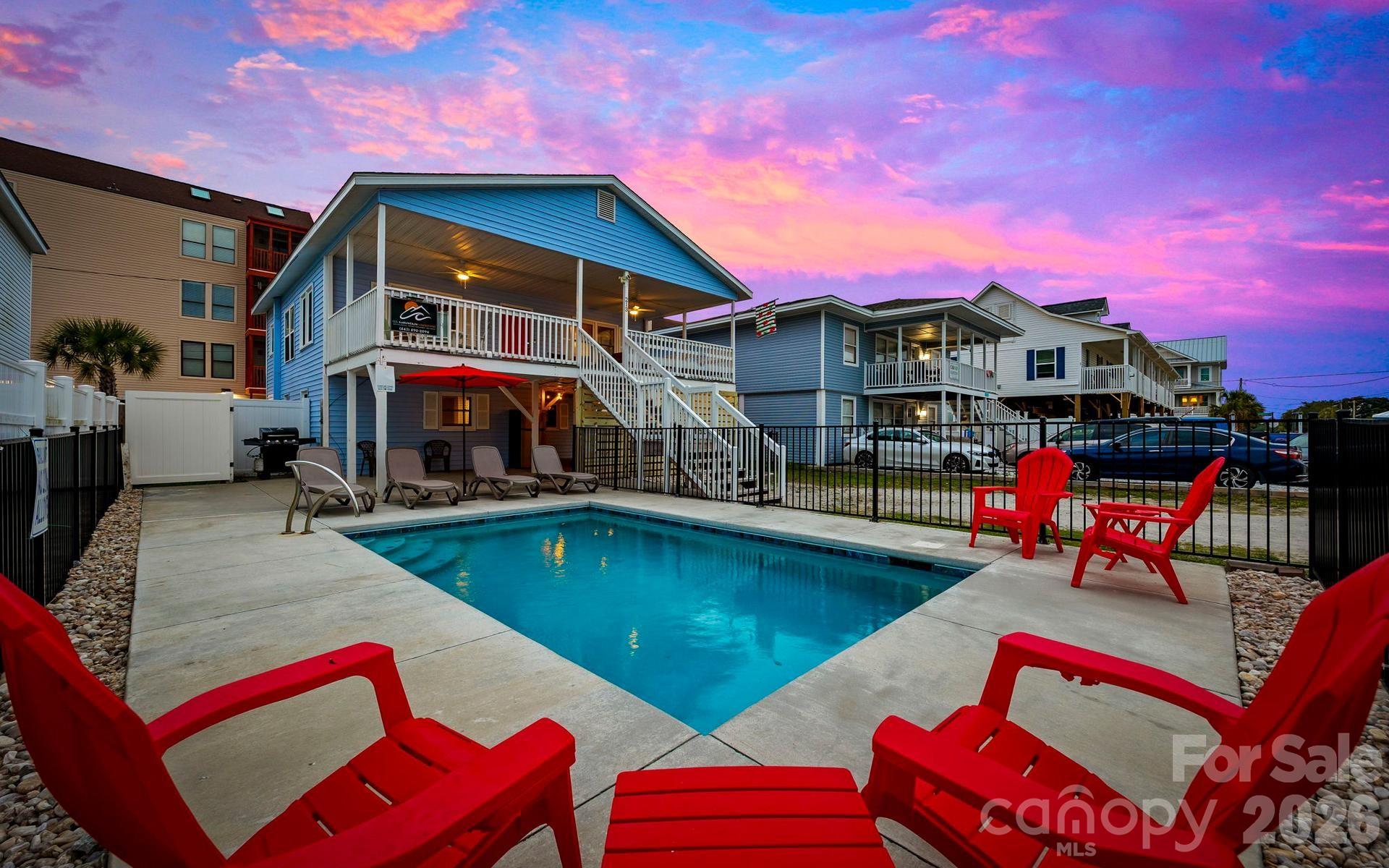 Turnkey Short-Term Rental Opportunity – “Cherry Groove,” Cherry Grove Beach, North Myrtle Beach

Steps from the sand and packed with income potential, “Cherry Groove” is a refreshed 4-bedroom, 2-bath coastal retreat that sleeps up to 16 guests. Located just 350 feet from the beach, this dual-level property blends nostalgic beach-house charm with modern upgrades and proven short-term-rental appeal. With a private pool, movie room, and separate entrances, it’s ideal for investors seeking strong ROI and consistent occupancy.

Investment Highlights

Sleeps 16 | 4 Bedrooms | 2 Baths

Two Levels w/ Separate Entrances & Indoor/Outdoor Stairs (Handicap Accessible)

Private Pool + Large Front Deck 350 ft from the Beach

Brand-New Movie Room w/ Projector & Popcorn Machine

Fresh Paint & Fixtures (2024 Renovation)

Smart TVs in Every Bedroom | High-Speed WiFi

Parking for 4–5 Vehicles | No HOA Restrictions

Turnkey and fully furnished, Cherry Groove allows investors to start earning income immediately—no delays, no remodel required.

Dual-Level Layout | Flexible Use

Perfect for multi-family vacations, reunions, or dual bookings, this home’s two-level design offers exceptional flexibility.

Upstairs: Bright open living area with coastal décor, dining for 12, and a fully equipped kitchen. Access the large deck overlooking the pool—an instant guest favorite.

Downstairs: A newly built movie room complete with a drop-down projector, popcorn machine, and vinyl record player. This added entertainment space sets the property apart in online listings and helps drive repeat guests.

Both floors can function independently, giving owners the option to occupy one level while renting the other—maximizing occupancy and return potential.

Upgrades & Amenities

Recent improvements include new paint, light fixtures, smart TVs, refreshed décor, and updated outdoor spaces.

Fully equipped kitchen with full-size appliances

Central A/C and heat

Washer & dryer

High-speed WiFi

Furnishings included and ready for guests

Everything today’s traveler expects—already in place.

Accommodations That Book

Comfortably sleeps 16 guests across 4 bedrooms and 2 baths—an ideal configuration for families and large groups.
Downstairs: 1 Queen + 1 Full Bunk Bedroom | 1 Bedroom with 2 Full Beds
Upstairs: 1 Full Bunk Bedroom | 1 King Bedroom
Two full bathrooms—one on each floor—make group stays effortless. Smart TVs in every room add extra guest appeal and higher nightly value.

Outdoor Spaces That Sell

Guests love the outdoor experience:

Private Pool (Open March–November)

Large Deck Overlooking Pool

Fresh Landscaping & New Privacy Slat Fencing

Ground-Level Patio + Outdoor Dining & Grill

Dog Area + 350-ft Walk to Beach

Whether relaxing poolside, grilling after a beach day, or enjoying cocktails at sunset, Cherry Groove offers the kind of lifestyle that keeps calendars full and reviews glowing.

Prime Location | Cherry Grove Performance Zone

This property sits minutes from:

Cherry Grove Pier & Boulineau’s Shopping Village

Top-rated restaurants, golf courses & nightlife

North Myrtle Beach Main Street

~30 min to Myrtle Beach International Airport

The walk-to-beach convenience, no-HOA freedom, and family-friendly environment make this home a consistent top performer.

Why Invest in Cherry Groove

*High occupancy potential in a proven tourism market
*Dual-level design supports multi-family or owner-occupancy models
*Turnkey condition – ready to list on Airbnb or VRBO immediately
*Pet-friendly & accessible = broader guest reach
*Strong appreciation potential in North Myrtle Beach’s rental corridor


“Cherry Groove” delivers the rare combination of charm, capacity, and cash-flow potential that investors seek. A true turnkey performer, it’s positioned for immediate rental income and long-term appreciation.