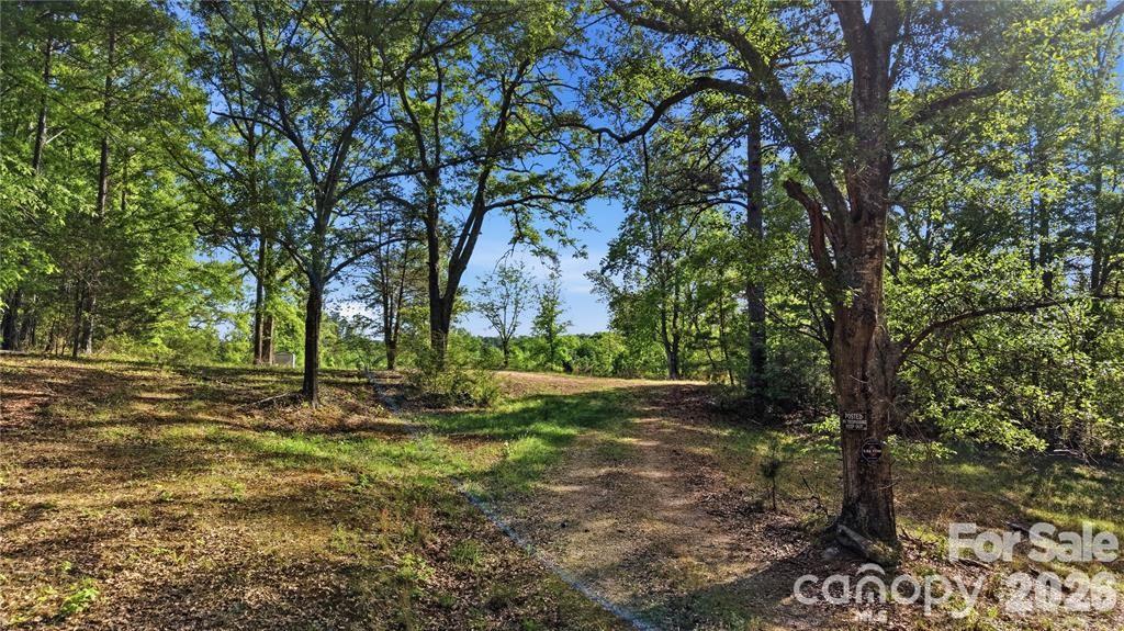Discover the possibilities with this beautiful 14.412 acres of land in the peaceful countryside of Chester, SC. This property offers a rare combination of prepared land and natural beauty, making it ideal for a private estate, mini-farm, or future development opportunity. One side of the property has already been cleared and bulldozed into two separate fields, complete with a road running alongside, providing easy access and multiple potential homesites. The property has significant groundwork that has already been completed, including a current perk test, a 6-inch working well and an established driveway into the property, saving time and expense for the next owner.