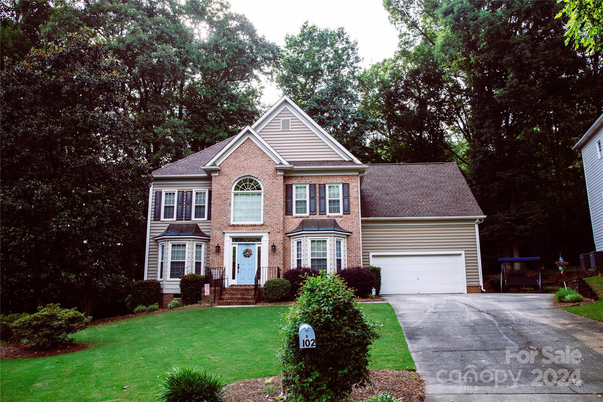 Wonderful location in the heart of Fort Mill! This well maintained 5 bedroom, 2.5 bathroom home is charming, cozy and ready for its new owner! Walk in to the two story foyer with beautiful wood floors and new windows throughout. On the main floor you will find an office space, dining room, kitchen with updated SS appliances, breakfast nook, living room with fireplace and sunroom that overlooks the backyard and deck. Spacious primary bedroom on second floor has vaulted ceilings and a large ensuite bathroom that has recently been updated, dual vanity and walk in closet. Upstairs you will also find 4 additional bedrooms (one of which could also serve as a bonus room), another updated full bath and ample storage. The garage is large and contains extra storage options. Quaint neighborhood with mature trees, low HOA and minutes from downtown Ft. Mill and hwy access. Top rated Fort Mill schools, Don't miss this!