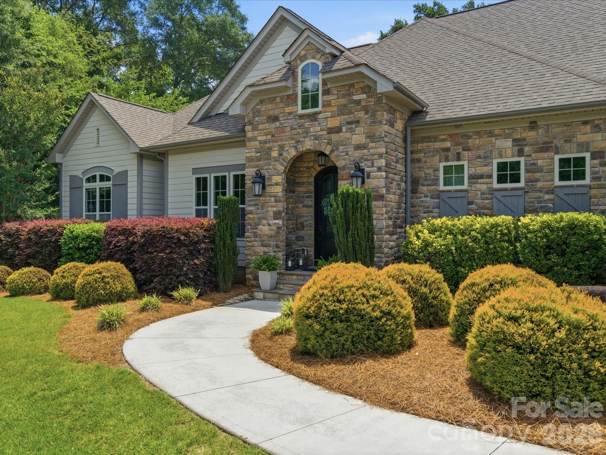 Custom Modern Transitional Ranch on Over an Acre in Premier Location!!

Exceptional craftsmanship and timeless design come together in this stunning custom-built ranch nestled on a beautifully landscaped one-acre homesite in one of Concord's premier locations.

From the moment you arrive, the stone façade, arched entry, and manicured grounds create a striking first impression. Inside, soaring 10-foot ceilings, 8-foot doors, site-finished hardwood floors, and abundant natural light showcase the home's exceptional quality and thoughtful design.

The thoughtfully designed custom floor plan features a dedicated office, spacious living areas, and a spectacular bonus room with a dramatic dormer window and built-in window seat, creating a versatile space for recreation, media, or guests.

At the heart of the home, the designer kitchen showcases beautiful granite countertops, 42" cabinetry, a large center island, and seamless flow into the living and dining spaces, where a striking custom feature wall creates an unforgettable setting for entertaining. The great room is highlighted by dramatic ceiling beams, expansive windows, and a stunning fireplace, creating an inviting gathering space year-round.

Outdoor living is equally impressive with a gorgeous screened porch overlooking the private backyard, plus a custom shaped patio and fire pit designed for entertaining or quiet evenings under the stars.

The neighborhood offers a refreshing pool, pickleball and tennis courts. 

Meticulously maintained and move-in ready, this exceptional property offers the rare combination of outstanding craftsmanship, timeless style, one-level living, and a picturesque acre setting just minutes from Concord's shopping, dining, and everyday conveniences. Listing Agents are Owners.