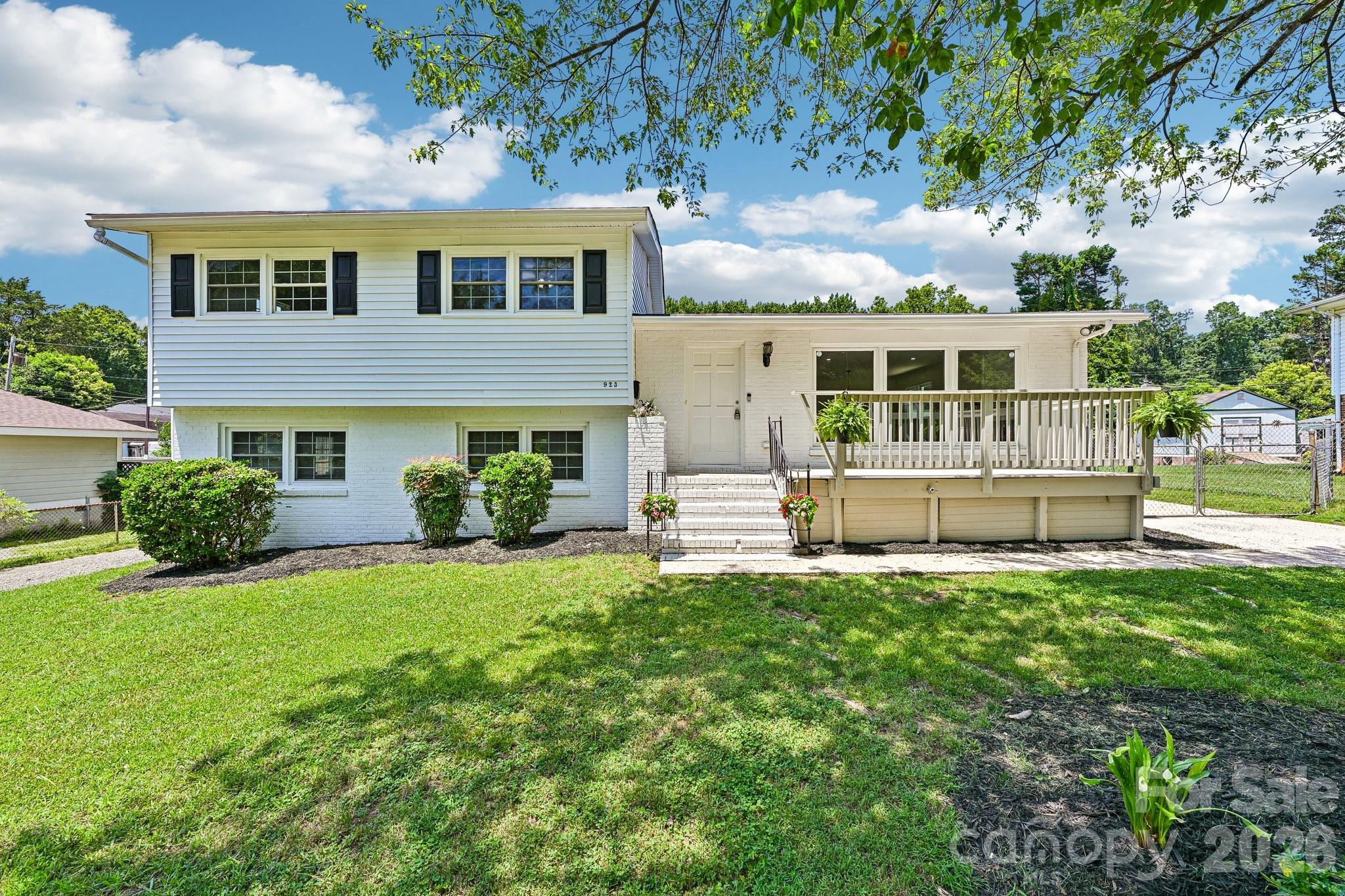 Welcome to 923 Yuma St, Charlotte, NC 28213, an updated home offering flexible living spaces and a convenient location with easy access to I-85, I-77, and I-485. Enjoy proximity to Uptown Charlotte, University City, NoDa, shopping, dining, parks, and everyday conveniences.

The main level features an open living area and a beautifully updated kitchen with quartz countertops, new cabinetry, and a designer backsplash. Recent improvements include a new roof, one updated HVAC system, and a new water heater, providing added value and peace of mind.

Upstairs, you’ll find three bedrooms and two full bathrooms. The lower level offers additional finished living space, including two rooms, a full living area, and a separate exterior entrance, providing flexibility for guests or home office.

Outside, enjoy dedicated parking and outdoor space ready for your personal touch. Whether you’re searching for extra room to spread out or a home with versatile living options in a central Charlotte location, this property is ready for you to explore. Schedule your private showing today!