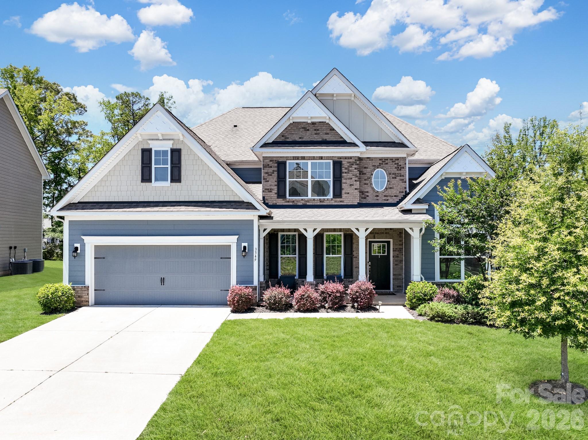 Welcome to 3349 Friendship Street, located in Indian Land’s highly desirable, resort-style community of Avondale! This gorgeous, site-built 2-story home showcases D.R. Horton’s coveted and expansive Waybury floor plan (spanning 4,149 sq. ft.). This layout perfectly blends structural elegance with effortless daily functionality. From the moment you step through the front door, you are greeted by an expansive, light-filled open-concept living space accented by a grand two-story foyer, a formal dining room, a private office/study space, and a cozy great room complete with a gas log fireplace.

The heart of the home is a gourmet chef’s dream kitchen, meticulously designed with upgraded white cabinetry, pristine quartz countertops, an oversized center island with a built-in breakfast bar, a massive walk-in pantry, and a dedicated plumbing line for an ice maker. Outfitted for seamless entertaining, the appliance package features a premium gas cooktop with an exhaust fan, a microwave, and double wall ovens. Upgraded luxury laminate wood flooring flows beautifully through all main-floor living areas, perfectly matching the home’s bright, modern design.

A standout feature of the main level is the highly sought-after downstairs guest suite, complete with its own dedicated sitting area and full bathroom—making it an ideal setup for multi-generational living, long-term guests, or a secondary primary suite.

Ascend to the upper level to discover the massive Primary Bedroom retreat, featuring tray ceiling details, an expansive walk-in closet, and a spa-like en suite bathroom equipped with a garden tub and separate shower. The second floor also features a spacious, flexible loft space, three additional large bedrooms (including connected Jack-and-Jill bathroom configurations), and a highly convenient upper-level laundry room outfitted with an electric dryer hookup.

Step outside into your spectacular, fully realized outdoor oasis. The original footprint has been transformed into an expanded custom patio featuring a built-in fire pit, making it the perfect setting for crisp evening gatherings or weekend entertaining. For the ultimate in climate control and privacy, the covered rear porch section is equipped with premium Crown automatic, retractable exterior roller shades. At the simple push of a button, you can command each shade individually, allowing you to easily block out the afternoon glare or open up the views exactly how you want them. The entire backyard oasis is beautifully maintained by an in-ground irrigation system. 

Additional infrastructure upgrades include a robust zoned heating and cooling heat pump system, a tankless water heater, a concrete driveway leading to an attached 2-car garage, and full architectural shingle roofing.

Community & Location:
Living in Avondale means embracing a luxury, active lifestyle. The mandatory HOA handles neighborhood upkeep, giving you full access to premier, resort-style amenities including a clubhouse, state-of-the-art fitness center, outdoor pool, playground, game court/pickleball courts, sidewalks, and streetlights. Located in Lancaster County (low SC taxes!) and zoned for highly rated Indian Land schools, this exceptional property sits just moments away from premier regional shopping, dining, and entertainment.