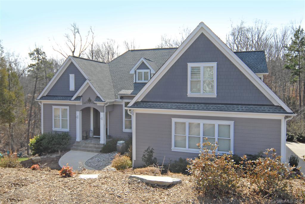 Impressive custom home w/major attention to detail & beautiful views of the water! Gated community. Open floor plan features 5 large bd/ 4 ba, master on main, HW throughout & storage galore! Kitchen has S.S. appliances, granite counters, soft close cabinets, informal dining, screened in porch w/fireplace. Great room; vaulted ceilings, large stone fireplace & massive windows, tons of natural light/water views! Butlers pantry, formal dining. Finished basement! Clover School District.