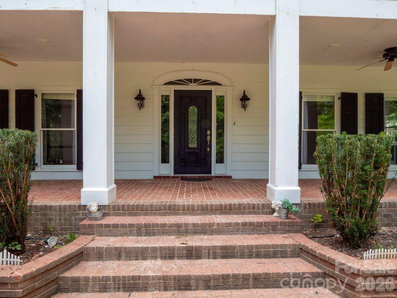 Gorgeous estate home harkens back to grandeur of yesteryear. This property has been used as a wedding venue and would be a perfect bed and breakfast/wedding venue or family compound. 9124 has unbelievable millwork, a grand foyer with fabulous staircase, marble floors, spacious rooms and rich hardwoods and barn. 9126 has 2 apartments and 3 car garage, a large parking pad, and storage.  9124 and 9126 have their own deeds. The tenants in 9126 are in place and would like to remain. Parcels have separate septic systems.  New septic tanks and new septic fields were installed by owners for $50,000. On 9126 the upstairs apartment rents for $1645 and has skylight and high ceiling, downstairs apartment rents for $1240, with owner paid electric. Beautiful covered back deck/porch on 9126. Adjoining Parcel #05-078-006-B  (Legal Description TRACT 1 0.51A 7892-271) is also available for purchase.