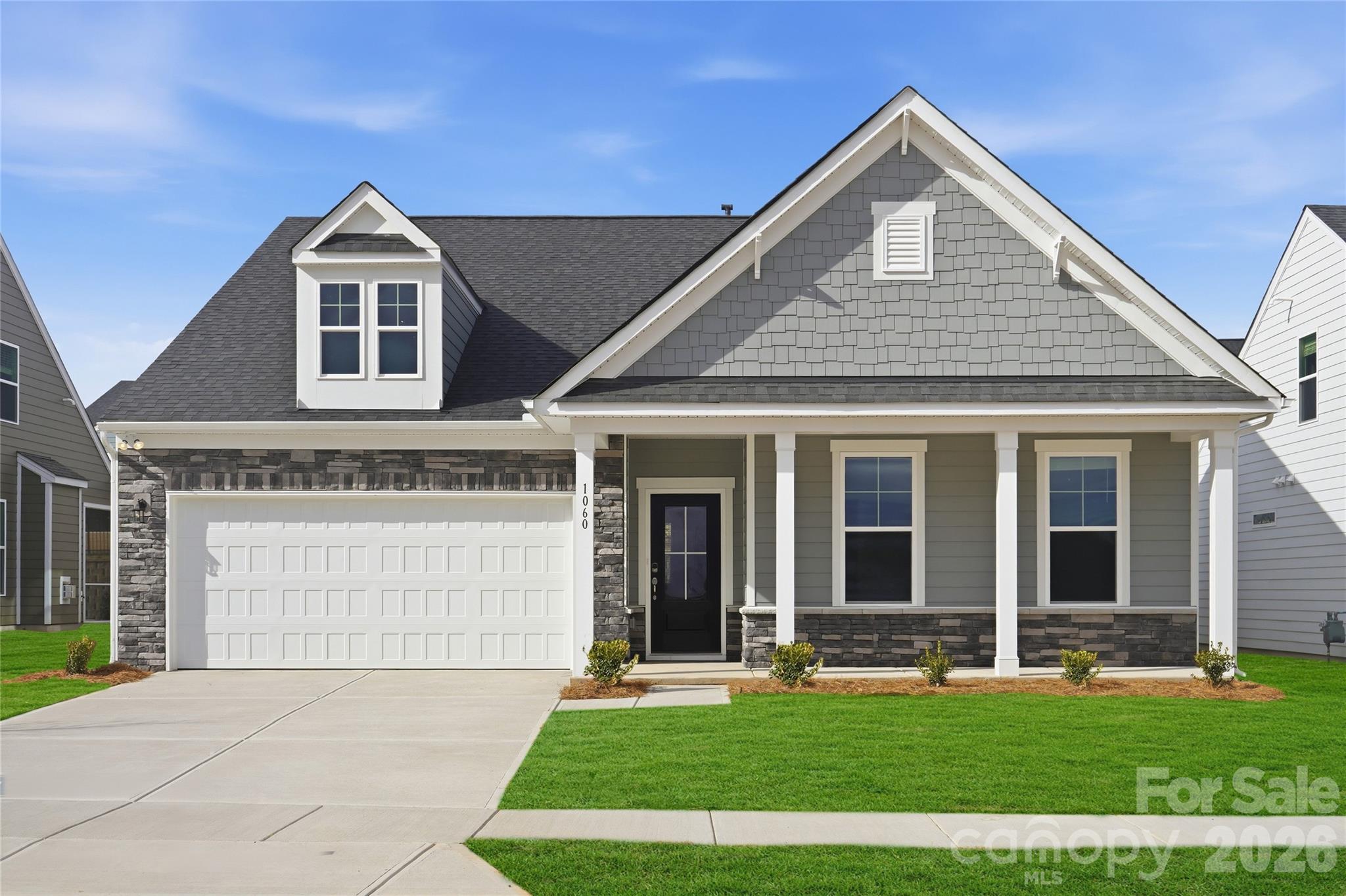 Thoughtfully designed 2-story home in a vibrant 55+ community, crafted for comfort and modern living. The main level features a spacious primary bedroom with a well-appointed full bath and generous closet space, alongside two additional bedrooms for guests or family. The kitchen, ideal for cooking and entertaining, boasts a large quartz island, sleek countertops, and premium appliances, perfect for hosting gatherings. A cozy pocket office with a built-in desk offers a quiet space for work or organization. The inviting family room, centered around a charming fireplace, creates a warm atmosphere for relaxation or social events. Enjoy the welcoming front porch for morning coffee or the tranquil rear screened-in porch for peaceful evenings. Upstairs, a spacious bonus room provides versatile space for hobbies, entertainment, or guest accommodations. This home blends contemporary style with timeless comfort in a lively community setting! Schedule a community visit today to learn more!
