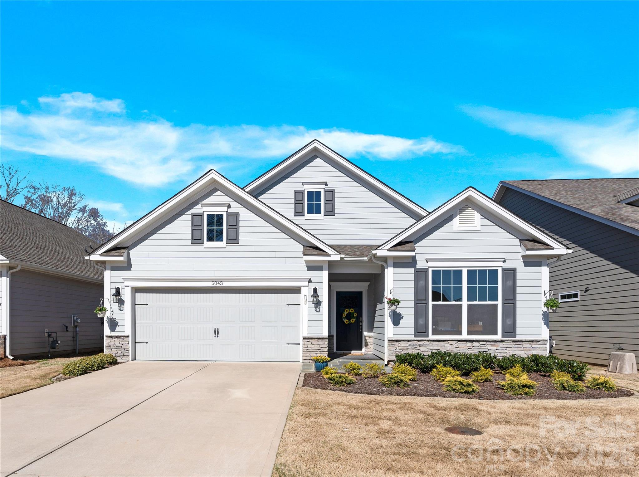 SELLER WILL ENTERTAIN OFFERS BETWEEN $395,000.00-$425,000.00 OR ABOVE. BRING OFFERS. Welcome to this beautiful home in highly sought after The Farm at Ingleside community. This transitional style Bristol floorplan boasts 3 bedrooms with one having French doors, lending itself to also being a versatile flex space. The primary bedroom offers a spacious ensuite bath with walk-in closet and provides a feeling of privacy and seclusion as it backs up to peaceful wooded views. Just beyond, you’ll find a huge closet with an attached laundry room and utility sink for maximum convenience. The main living area offers an open floorplan that includes the kitchen with quartz countertops, a gas range, beautiful island with ample space for any chef, and an adjacent living room with a gas fireplace. The dining area connects via glass sliding doors to the covered rear patio with private wooded views. The spacious attached garage is upgraded with epoxy floors. Through that door you will find a very convenient, newly installed drop zone which is also adjacent to the laundry room. 
This lovely home offers the freedom for you to enjoy the numerous amenities (community pool, fitness center, clubhouse, pickleball courts, bocce ball and more) while the HOA maintains the community and handles lawn maintenance for you. Your new home offers great location, convenience to area shopping, restaurants, uptown Charlotte, airport and Lake Norman...just minutes away.  This move-in ready home is the perfect blend of community, privacy, lifestyle and convenience.
