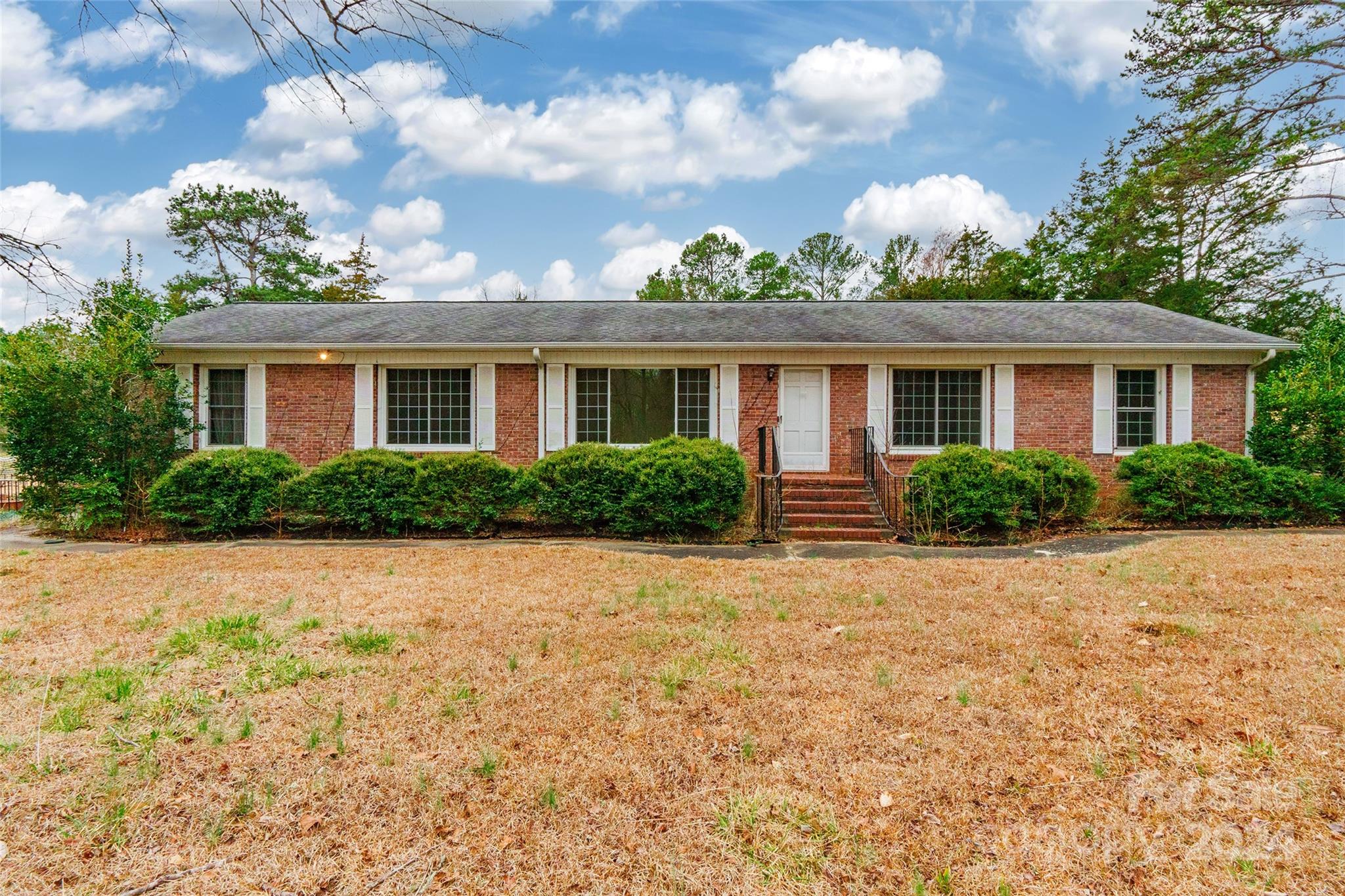 Welcome home to this charming brick ranch, tucked away on a spacious 1.29-acre lot. With 3 bedrooms and 2 baths, this home offers a comfortable and inviting layout.  Step inside to discover delightful features including a  formal dining room, a formal living room, and a cozy den with a gas log fireplace - ideal for relaxing evenings. 
The kitchen is bathed in natural light from numerous windows, creating a warm and welcoming atmosphere for cooking and entertaining. Outside, a detached garage and shed provide ample storage space, ensuring all your belongings are neatly organized. Notable upgrades include a newer roof, water heater, HVAC system, well bladder, and vinyl windows, offering peace of mind for years to come. Enjoy the tranquility of the small private neighborhood and envision the endless potential of this home. Don't miss out on the opportunity to make this charming brick ranch yours! Please note, the sale of the home is subject to court approval.