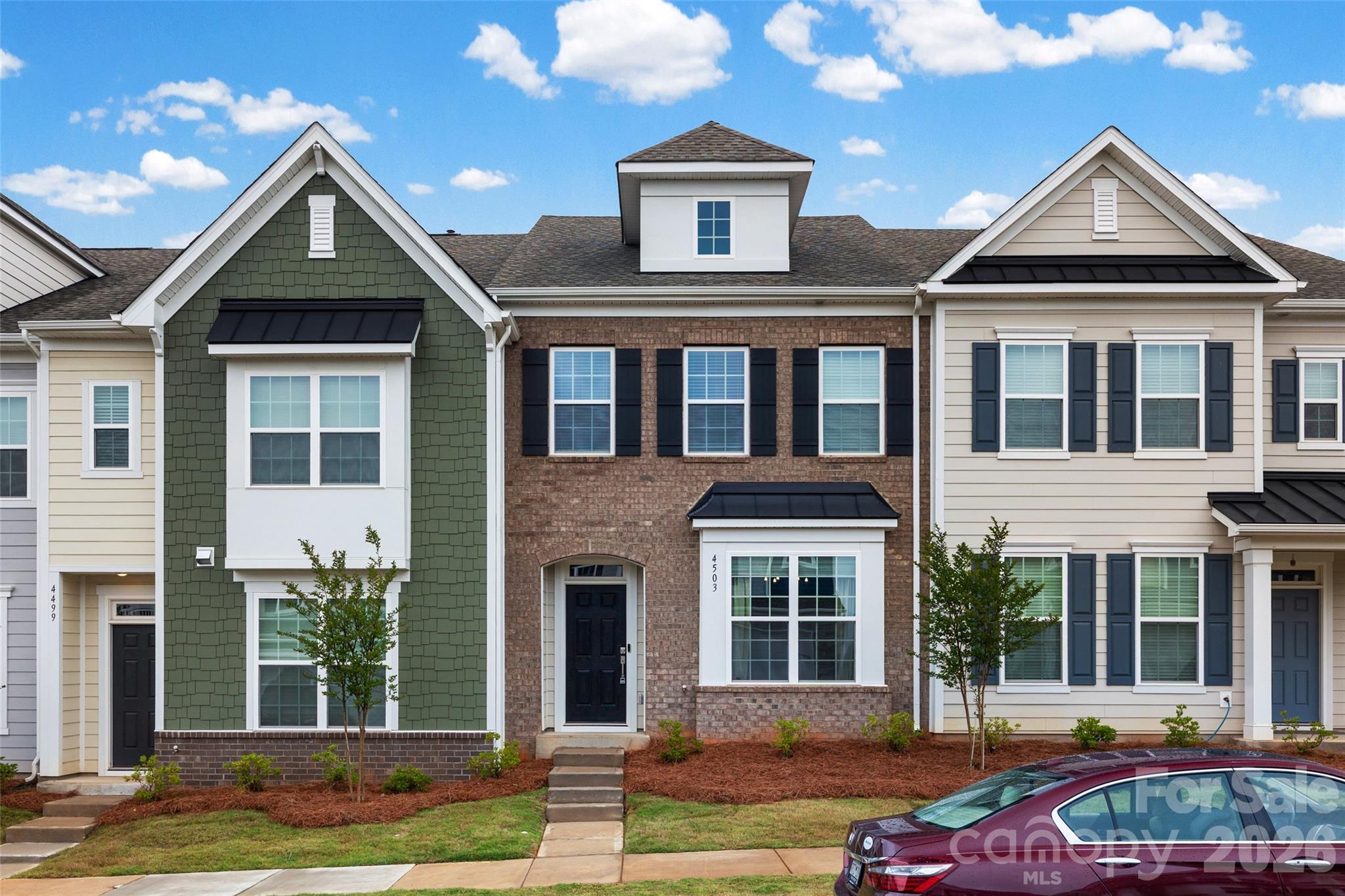 Step into modern living with this newly built 2025 two-story townhome offering 3 bedrooms, 3 baths, and 1,905 sq ft of thoughtfully designed space. A welcoming entrance foyer leads into an open floor plan perfect for both everyday living and entertaining. The kitchen features a spacious island and updated appliances, seamlessly connecting to the main living areas. A designated office on the main floor with double glass doors provides the perfect work-from-home setup. This home also includes an efficient electric water heater and a 2-car garage equipped with a Tesla 240V/48A Gen 3 Wall Charger—ideal for EV owners. Located in the desirable Elizabeth community in Fort Mill, known for its great schools, residents enjoy current and future amenities including a swimming pool, clubhouse, fitness center, sports courts, playground, walking trails, and more.