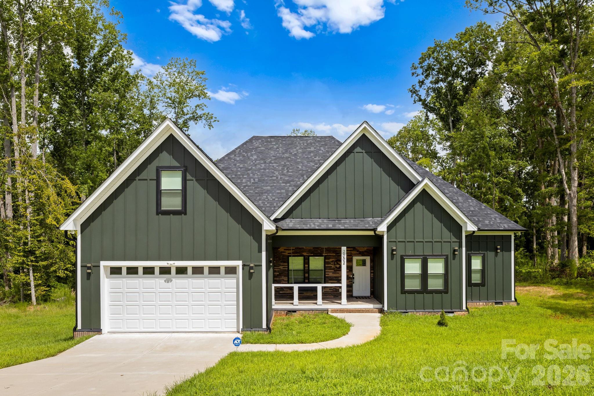 Charming 4-Bedroom Country Retreat on 1 Acre. Escape to your own peaceful oasis on a rare, expansive 1-acre lot in a serene, quiet neighborhood in Bessemer City – the perfect blend of privacy and convenience! Step onto the inviting covered front porch featuring elegant tile flooring, a stunning tongue-and-groove shiplap ceiling, stone veneer accents, and sleek cabled handrails – setting the tone for the exceptional craftsmanship inside. This move-in-ready single-family home boasts an open, airy floor plan with soaring ceiling heights in the foyer and great room that create a bright, spacious feel. Enjoy modern luxury with luxury vinyl plank (LVP) flooring throughout, a striking accent wall, cozy electric fireplace, and contemporary LED pendant lighting. The heart of the home shines in the gourmet kitchen, complete with stainless steel appliances, an undermount sink, crisp white shaker cabinets (including illuminated glass uppers for display), and sleek quartz countertops – ideal for everyday meals or entertaining. Upstairs, a large bonus room above the garage offers endless possibilities: a quiet home office, fun playroom, or personal theater retreat. With 4 generous bedrooms and 3 full baths, this home delivers comfort, style, and room to grow – all on a tranquil, private lot that feels worlds away yet close to everything Charlotte offers. Don't miss this rare opportunity – schedule your private tour today!