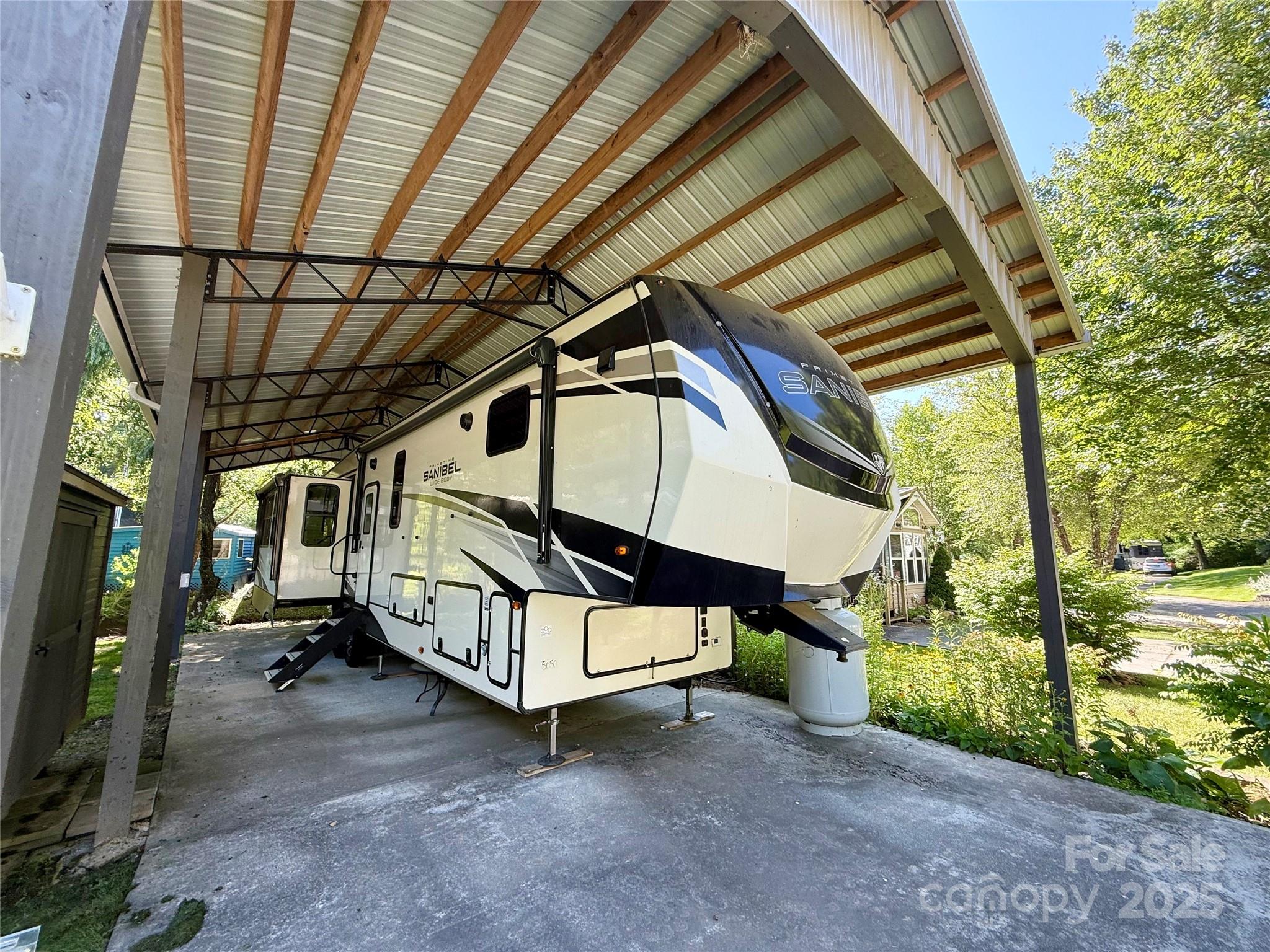 Escape to peaceful creekside living in this beautifully maintained 2022 RV, perfectly situated to enjoy nature without sacrificing comfort. This fully furnished 1-bedroom, 1 1/2 bath home features an expansive deck overlooking the creek—perfect for morning coffee or evening relaxation. Enjoy easy access and a shared, well-maintained property complete with a covered carport and a storage building for your convenience. The RV offers a cozy yet functional layout, making it ideal for full-time living or a weekend getaway. Don’t miss this rare opportunity to live in a tranquil setting with modern comforts and beautiful views just outside your door.